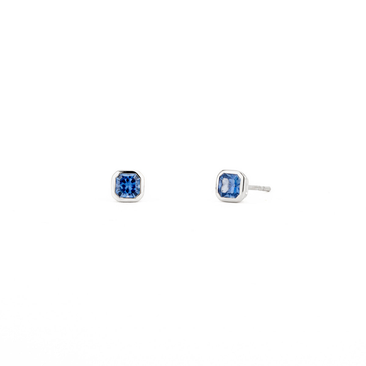 14k white gold bezel set radiant cut blue sapphire stud earrings