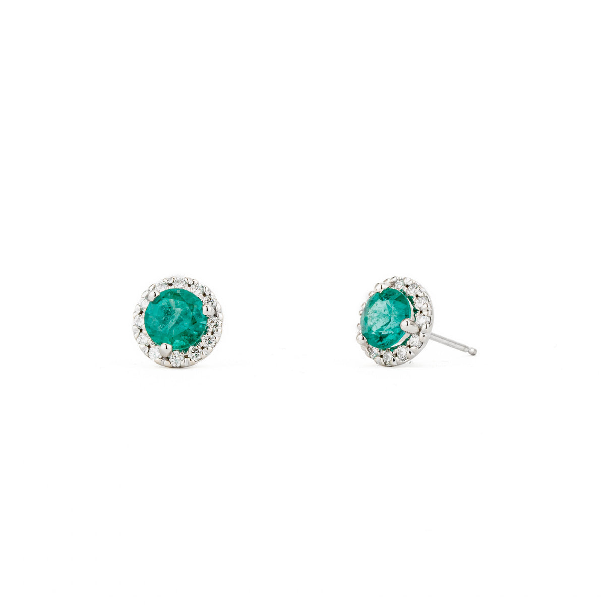 14k white gold emerald halo stud earrings featuring round Zambian emeralds and diamond accents