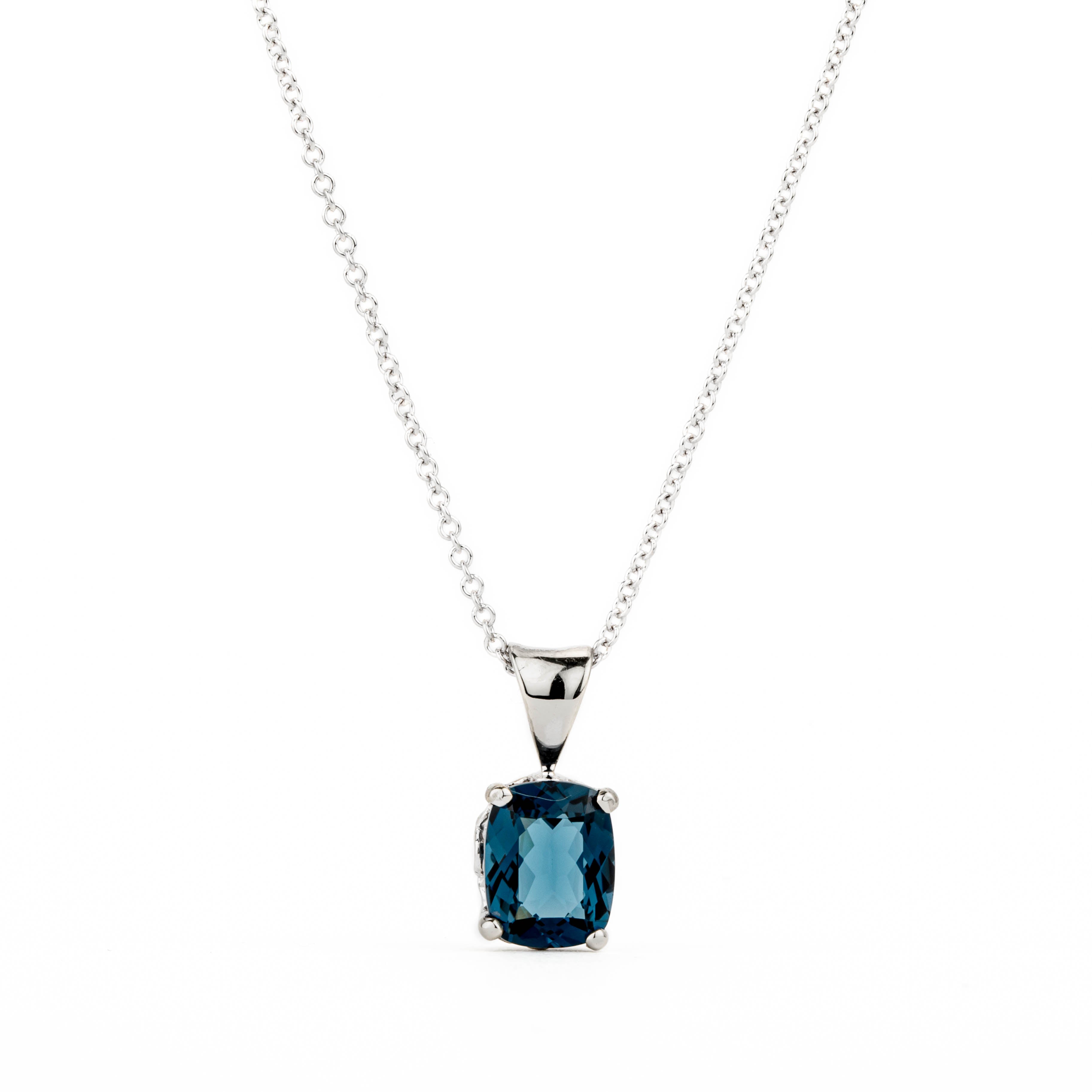 14k white gold pendant with prong-set cushion-cut London blue topaz and fleur de lis bail detail