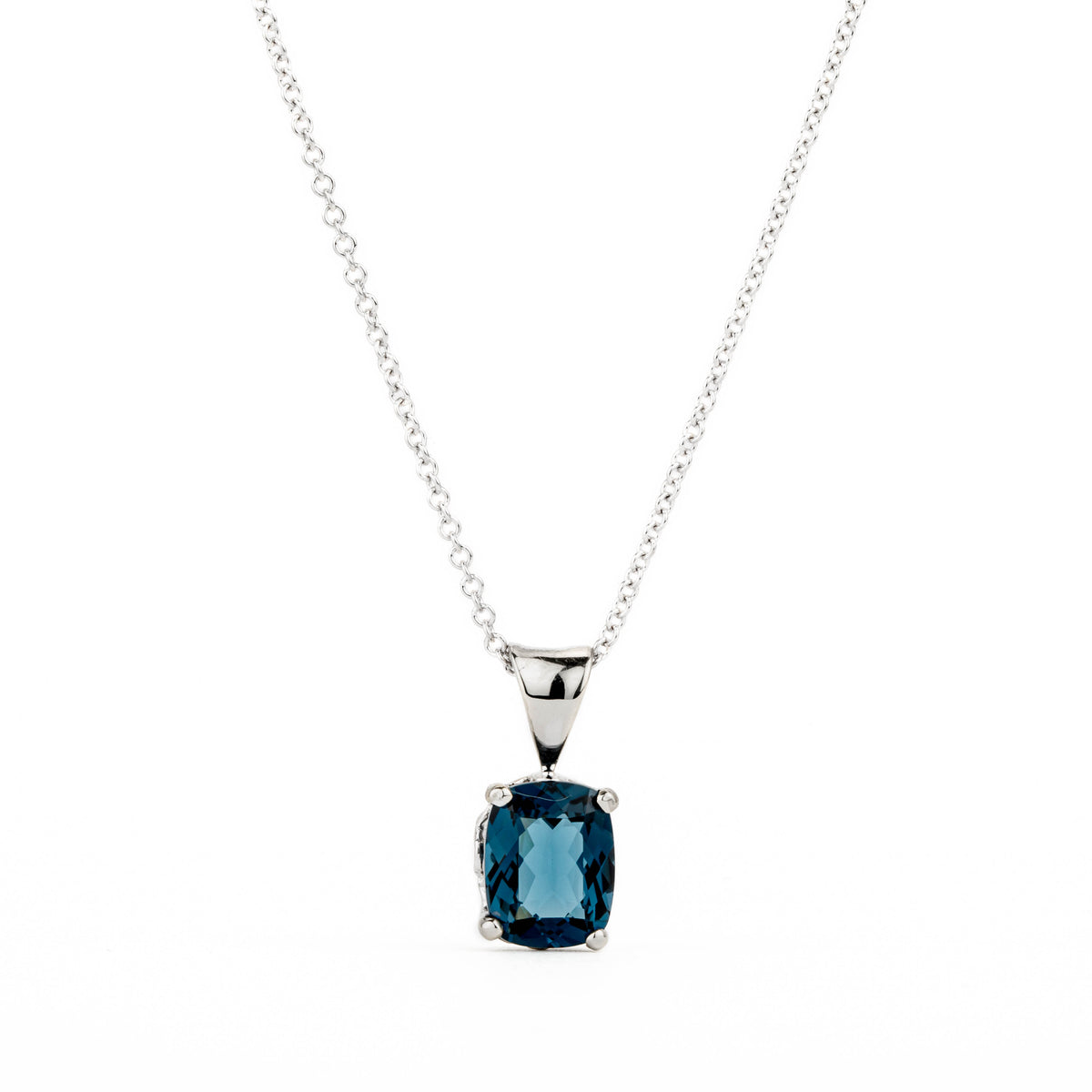 14k white gold pendant with prong-set cushion-cut London blue topaz and fleur de lis bail detail