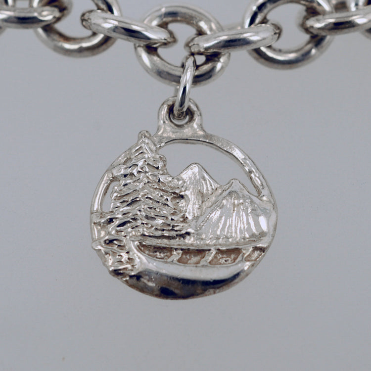 14k white gold Adirondack mountain pendant with pine tree and canoe design from our Saratoga Collection