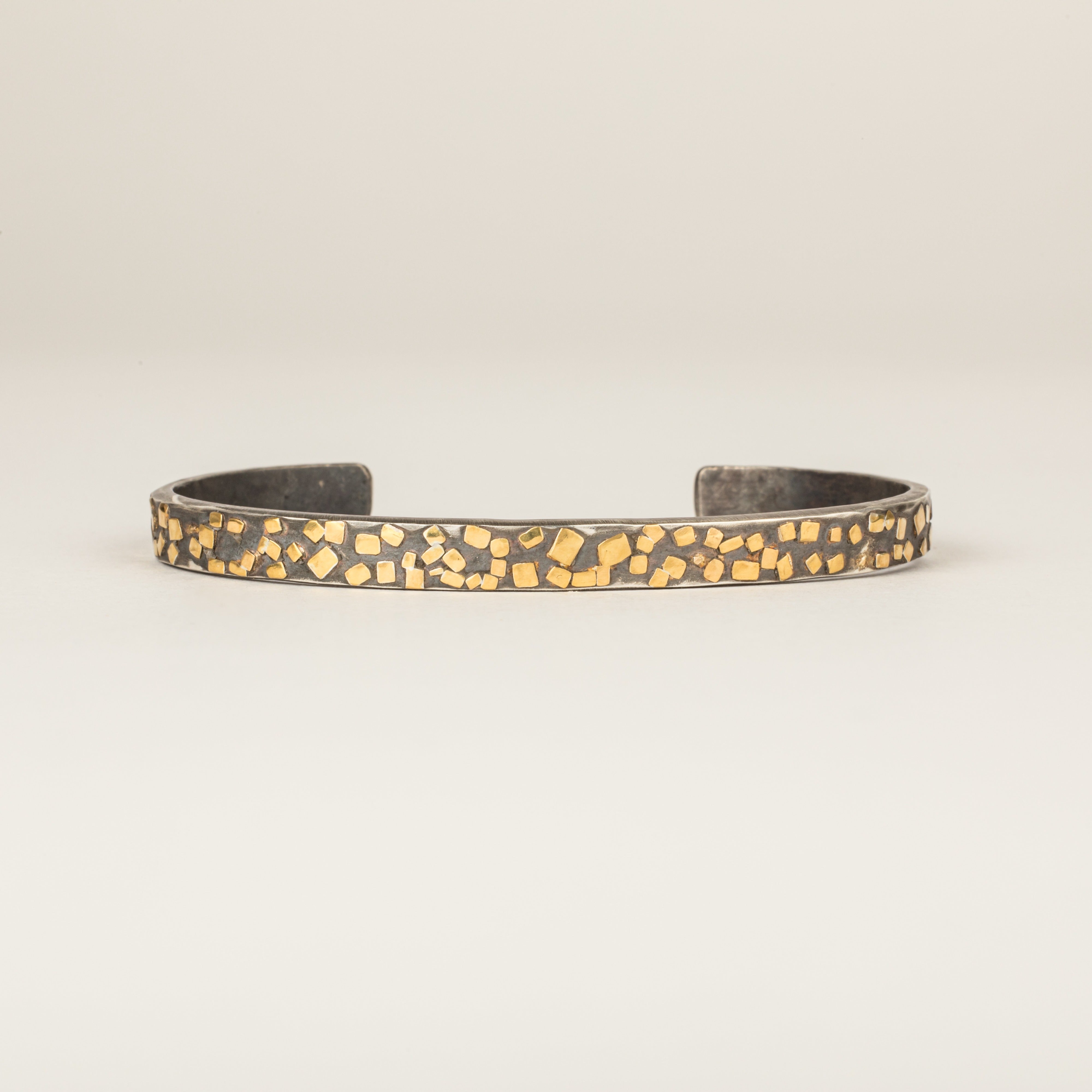 Oxidized sterling silver cuff bracelet with scattered 22k yellow gold flake accents