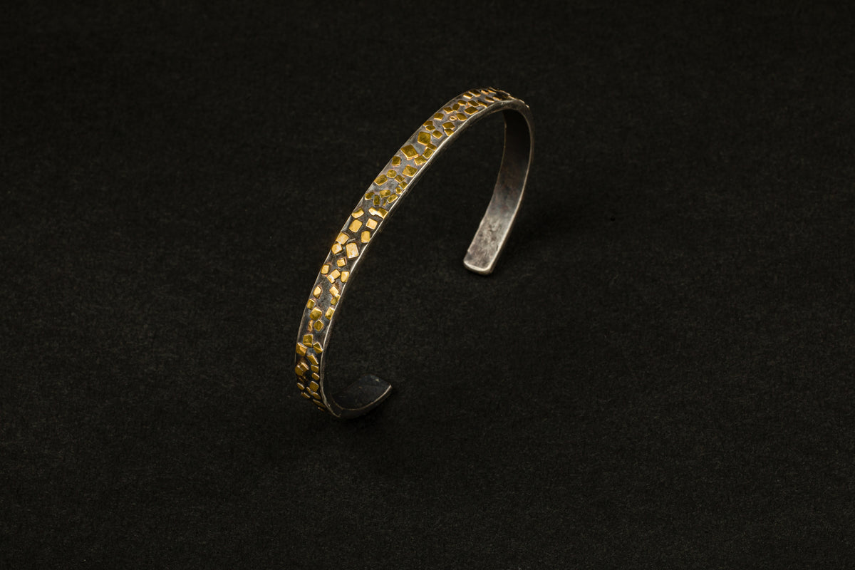 Oxidized sterling silver cuff bracelet with scattered 22k yellow gold flake accents
