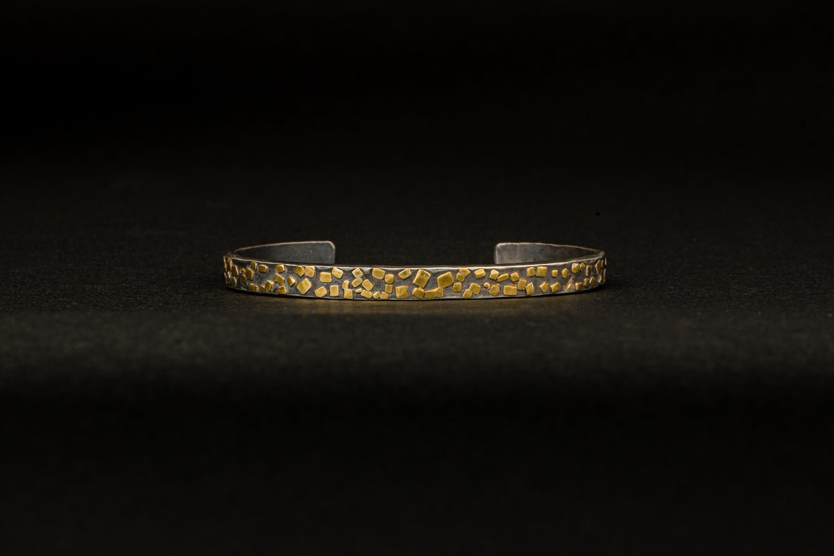 Oxidized sterling silver cuff bracelet with scattered 22k yellow gold flake accents
