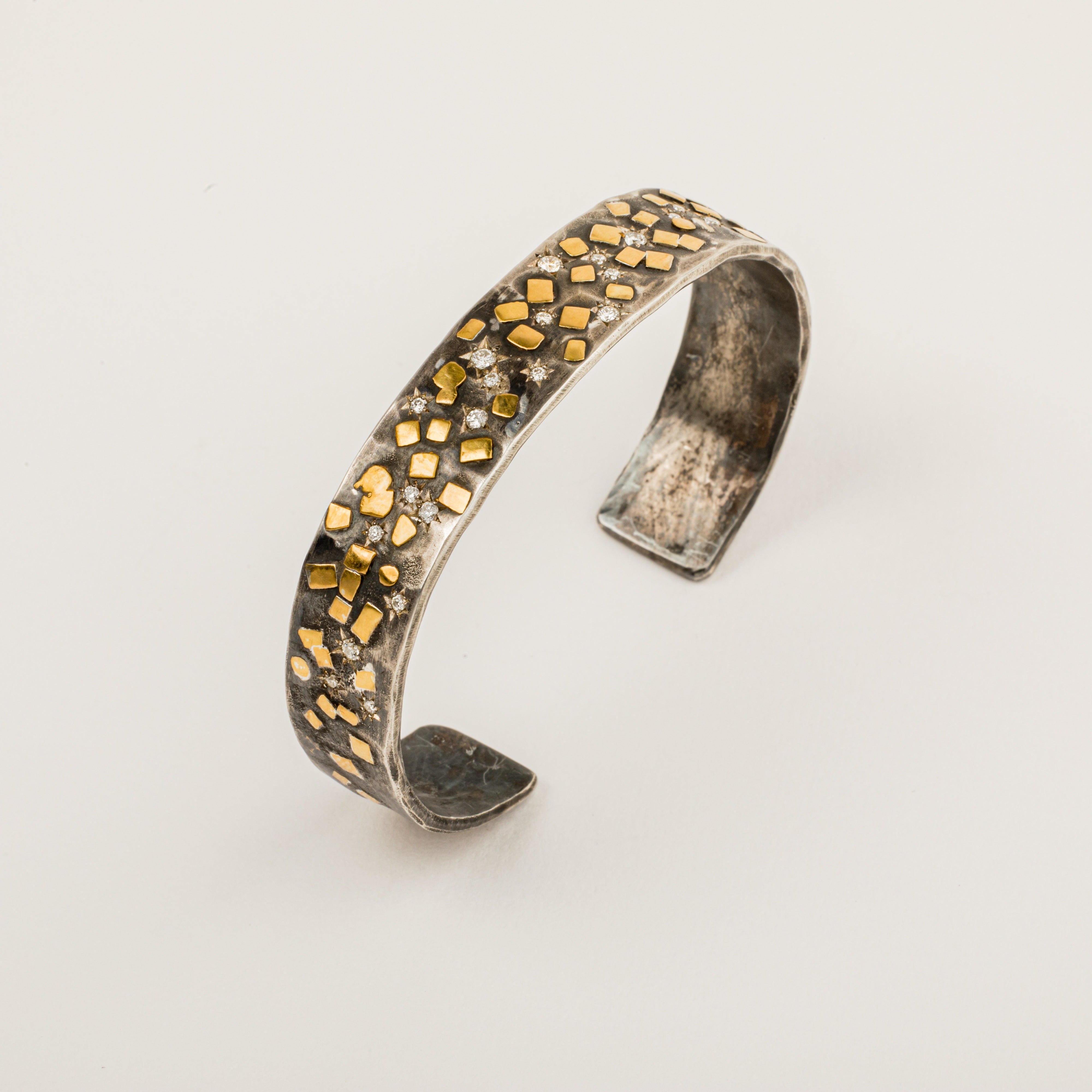 Oxidized sterling silver cuff bracelet with scattered 22K yellow gold flake accents and 24 star-set diamonds