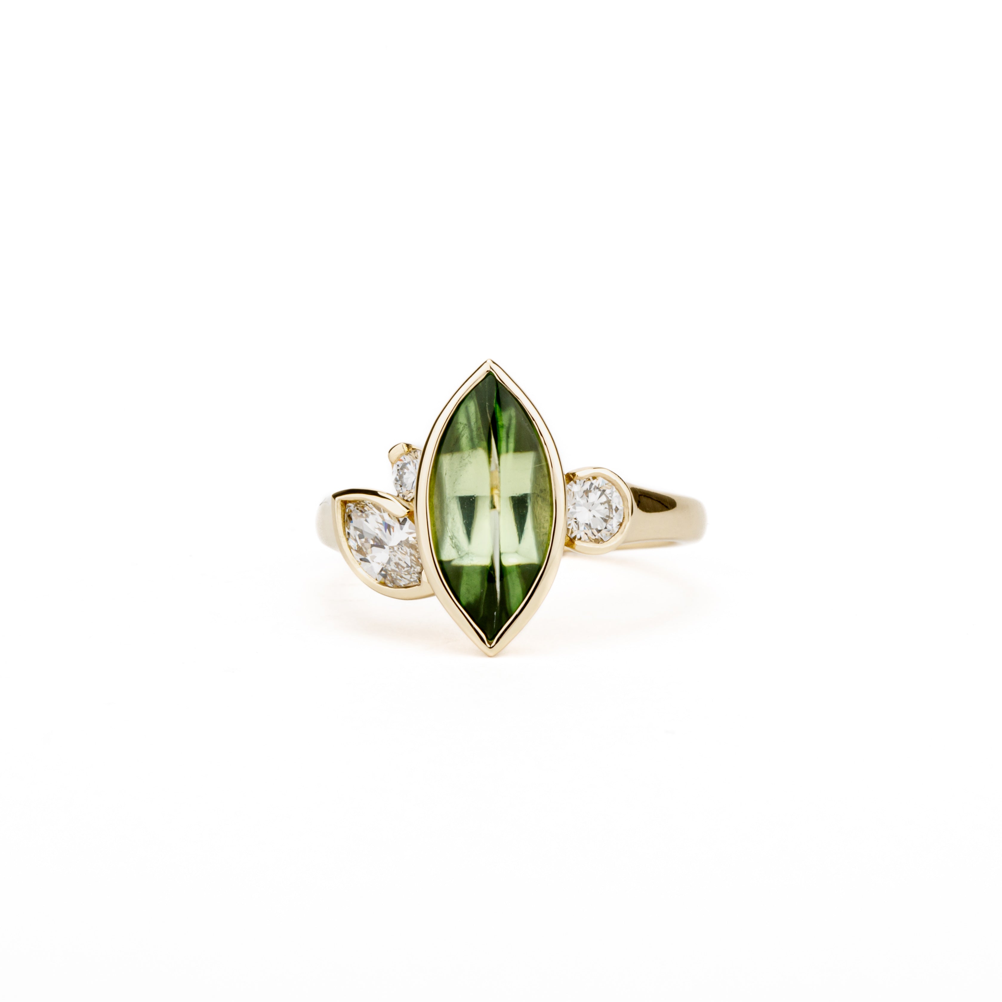 Marquise peridot and diamond ring in 14k yellow gold with bezel setting and asymmetric design