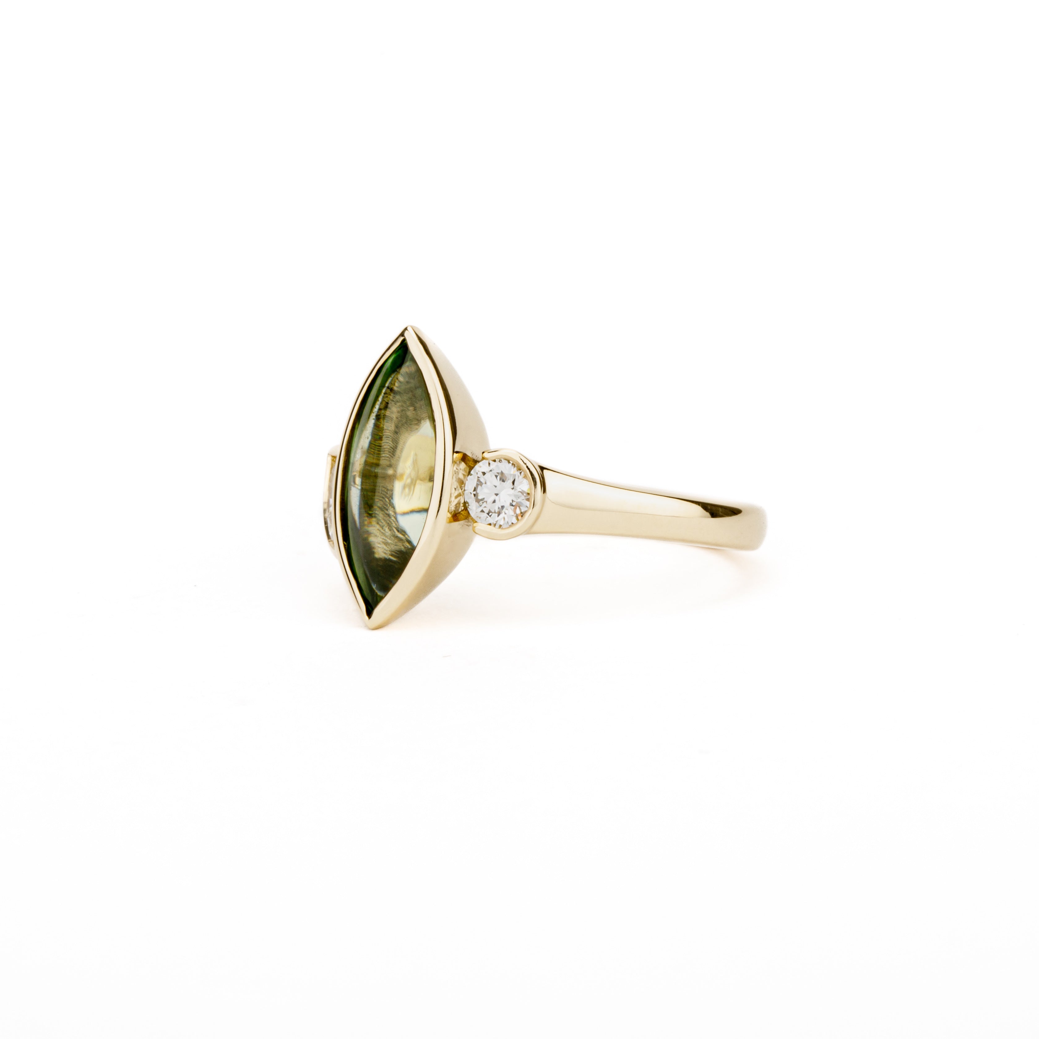 Marquise peridot and diamond ring in 14k yellow gold with bezel setting and asymmetric design