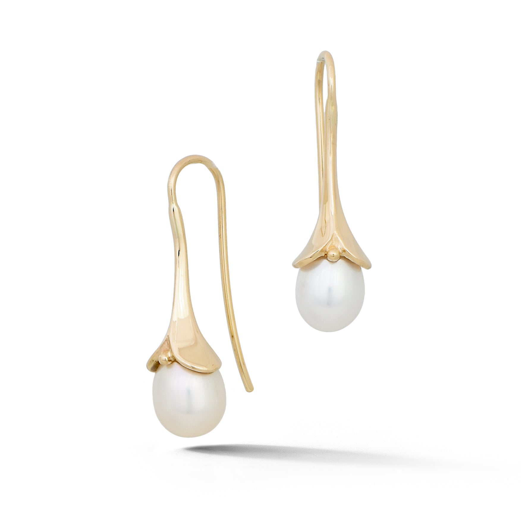 White pearl drop earrings with sculptural 14k yellow gold caps with french wire hooks