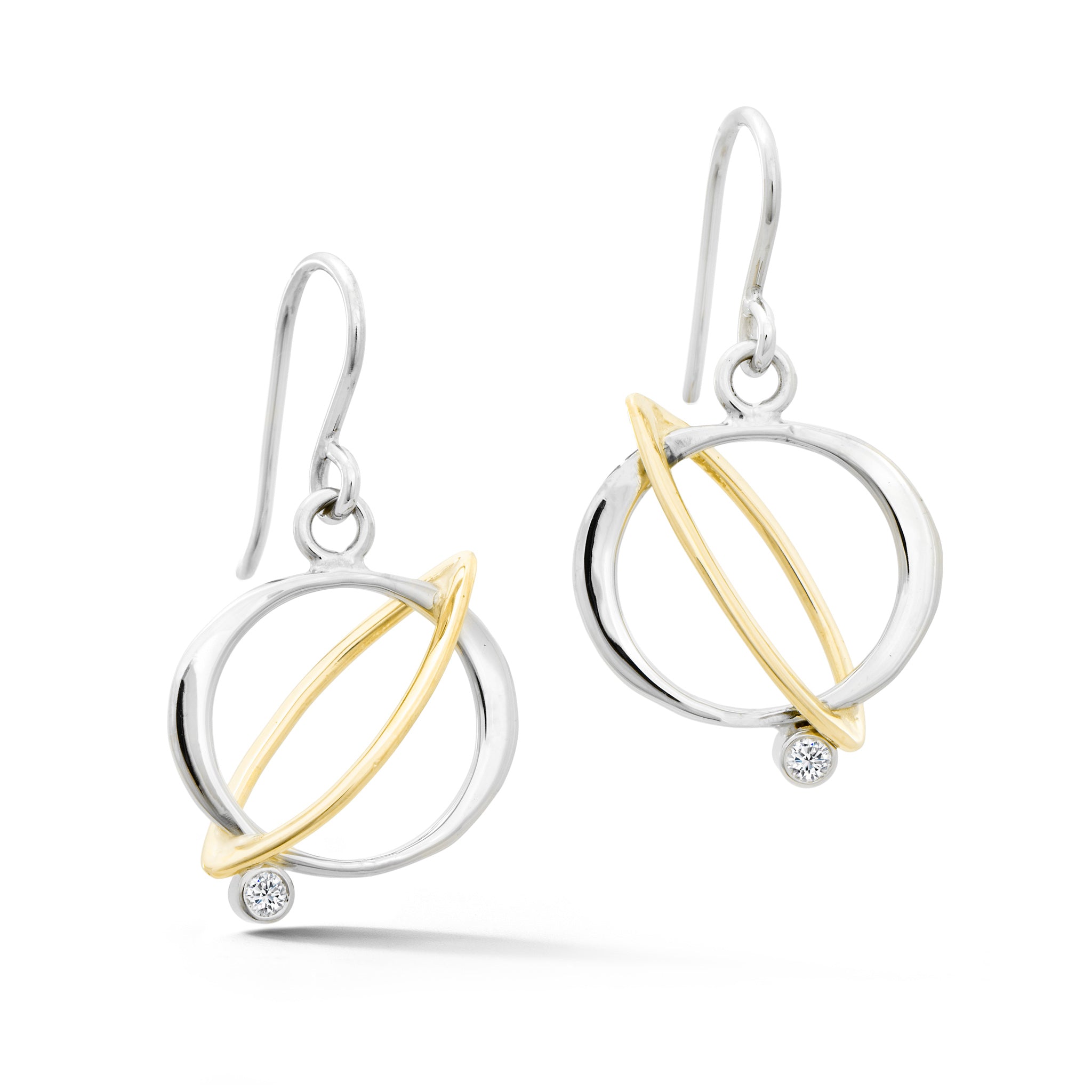 Two-tone orbit earrings in white and yellow gold with diamonds on French wire hooks
