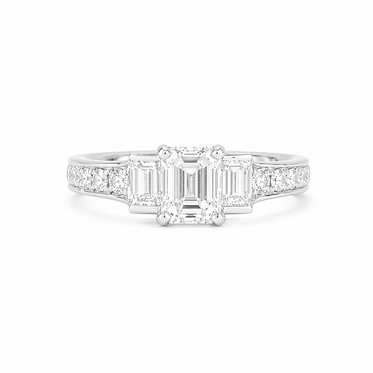 Emerald cut diamond engagement ring with baguette diamond accents and round pave set diamonds. deJonghe Original Jewelry