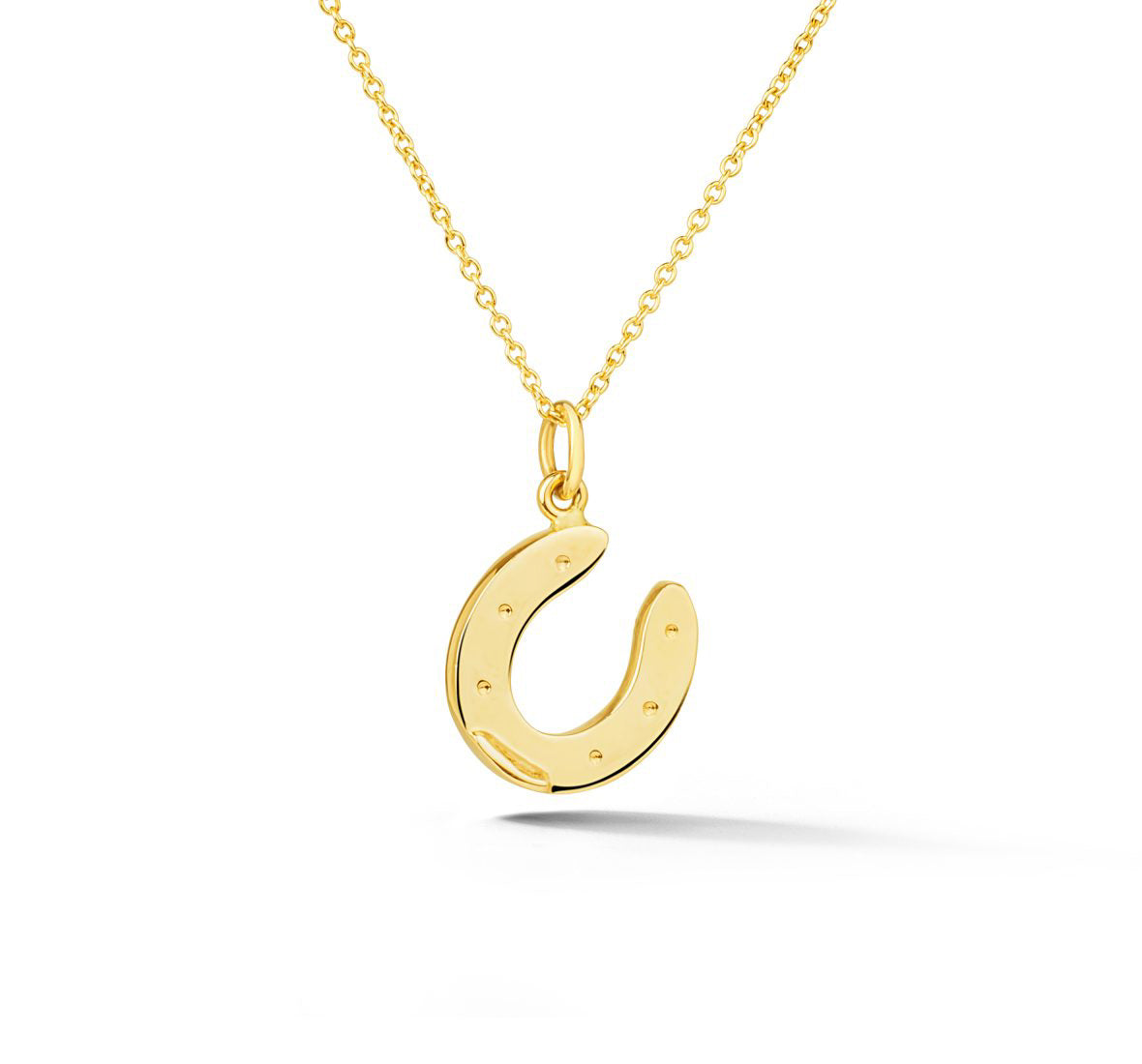 14k yellow gold horseshoe pendant with nail hole details from deJonghe Jewelry exclusive Equestrian Collection