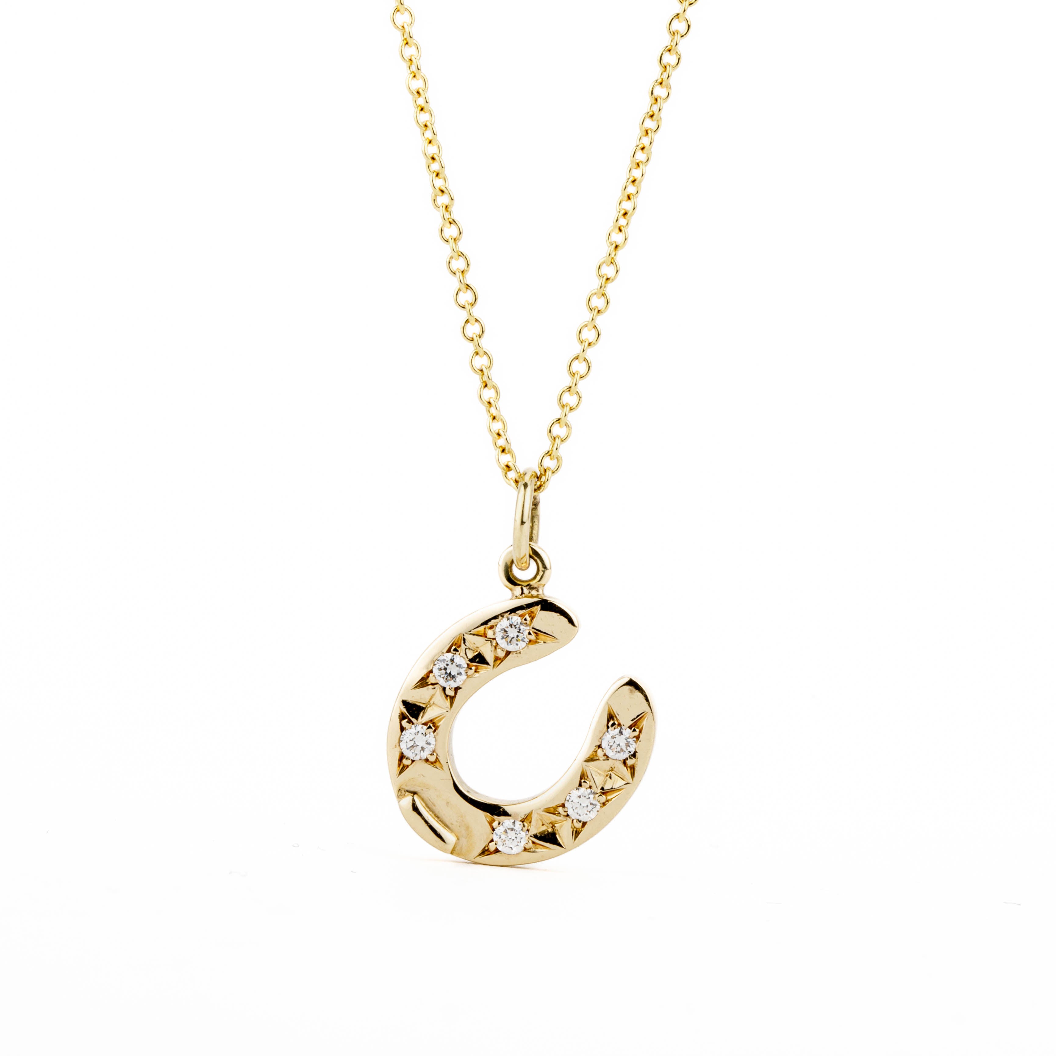 14k yellow gold horseshoe pendant with diamonds from deJonghe Jewelry's exclusive equestrian Collection