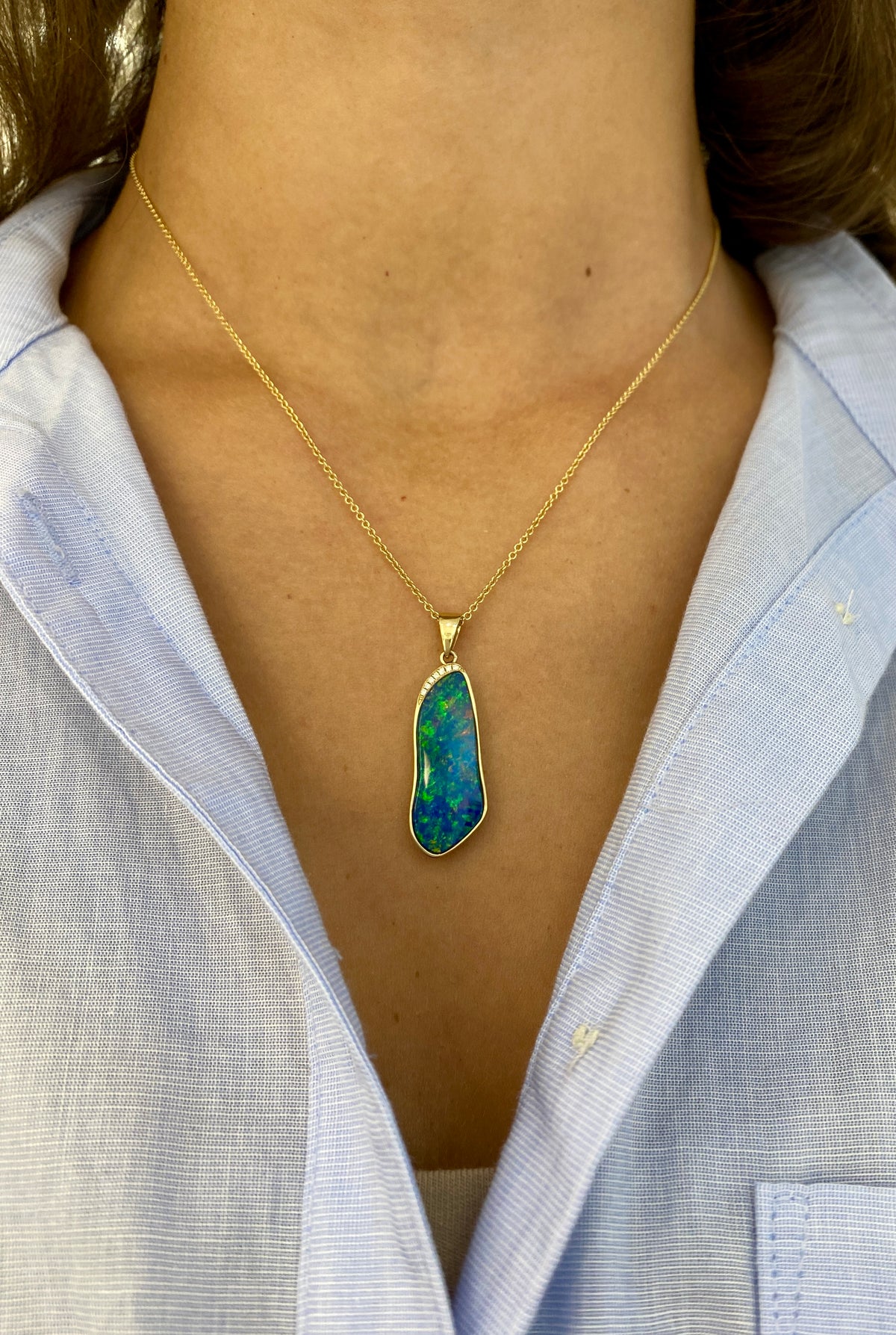 14k yellow gold pendant necklace featuring a large freeform opal doublet with pavé diamond accent