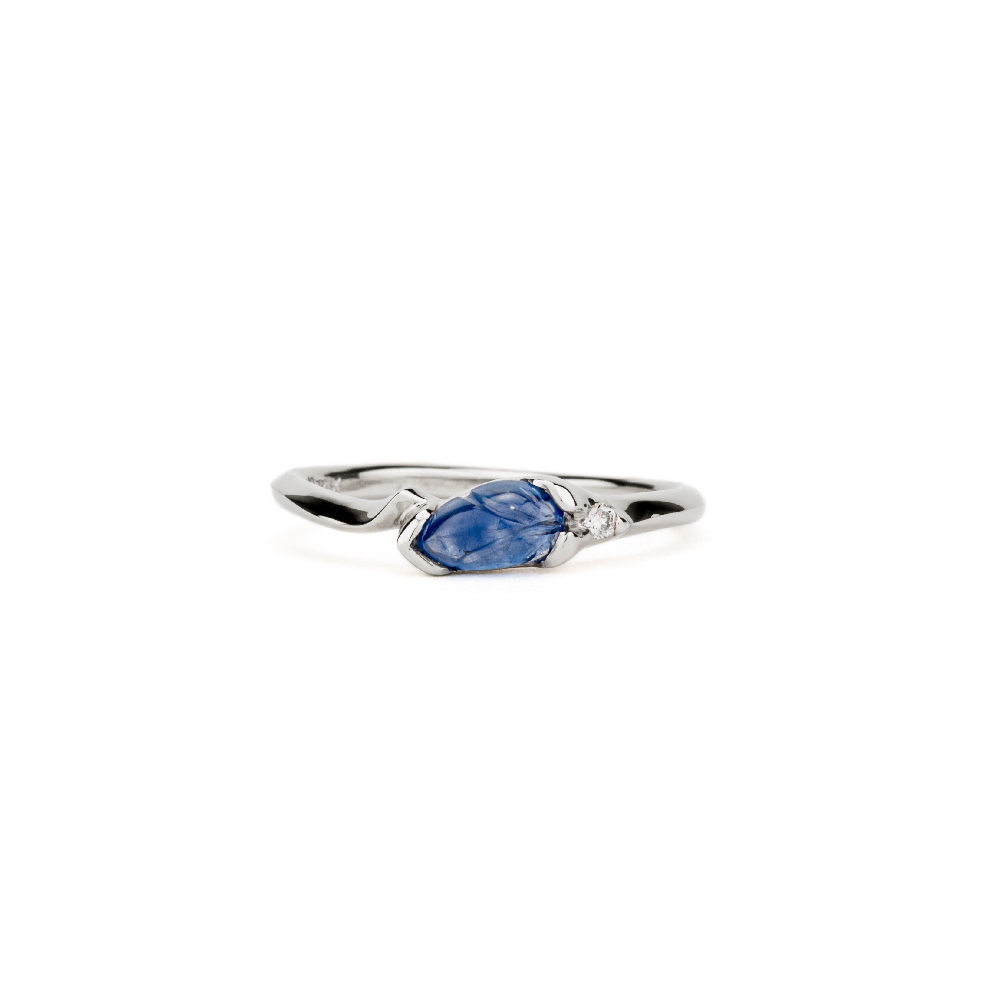 One of a kind carved blue sapphire leaf ring with diamond accent in white gold by deJonghe Jewelry