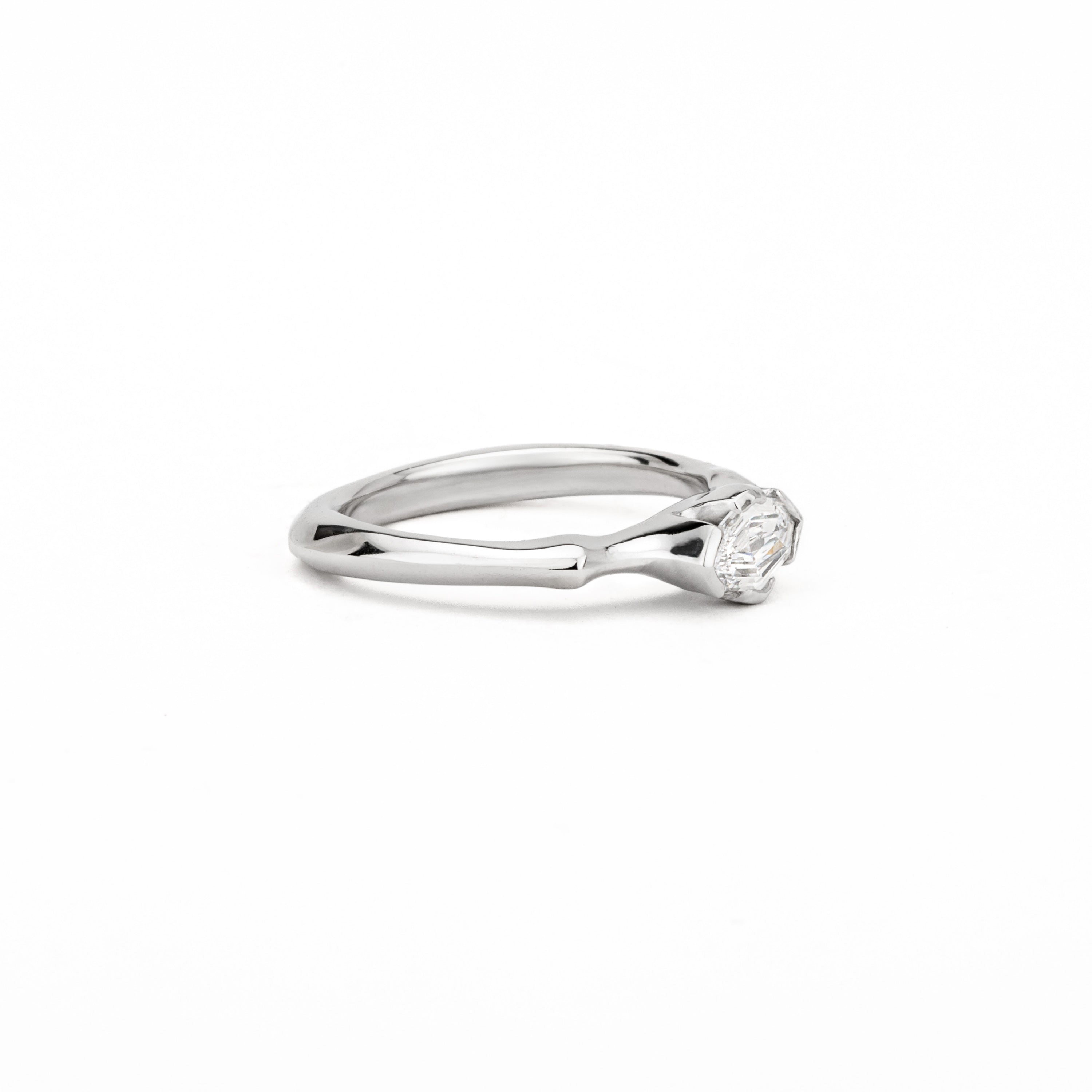 One of a kind platinum ring with fancy oval diamond in sculptural wrap setting