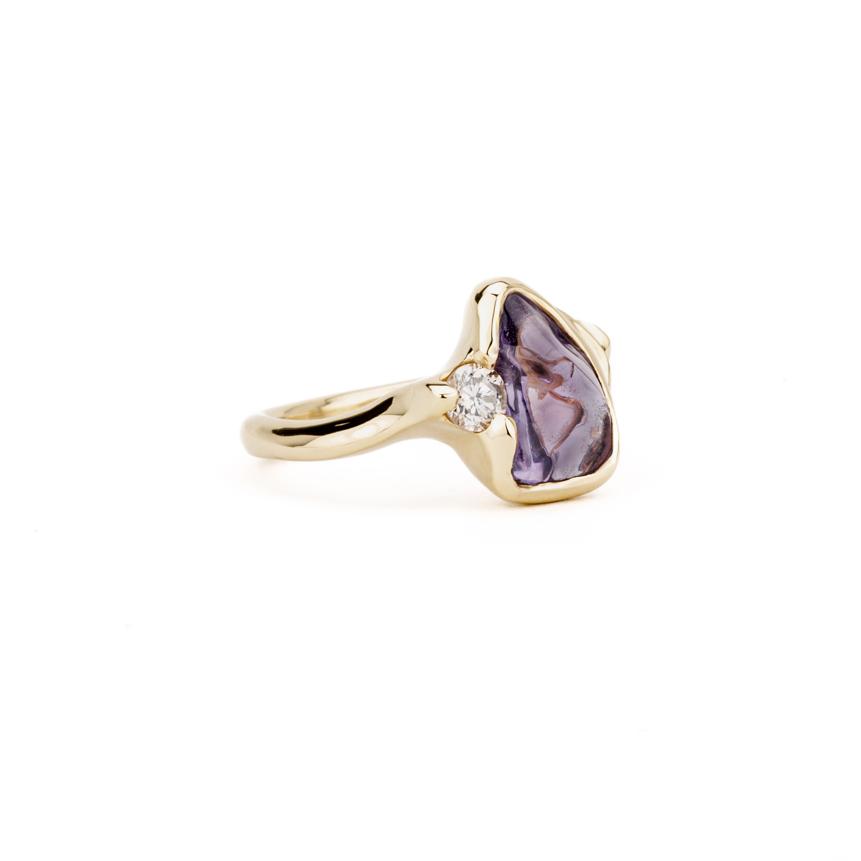 One of a kind purple sapphire cabochon ring with champagne diamond accent in 14K yellow gold