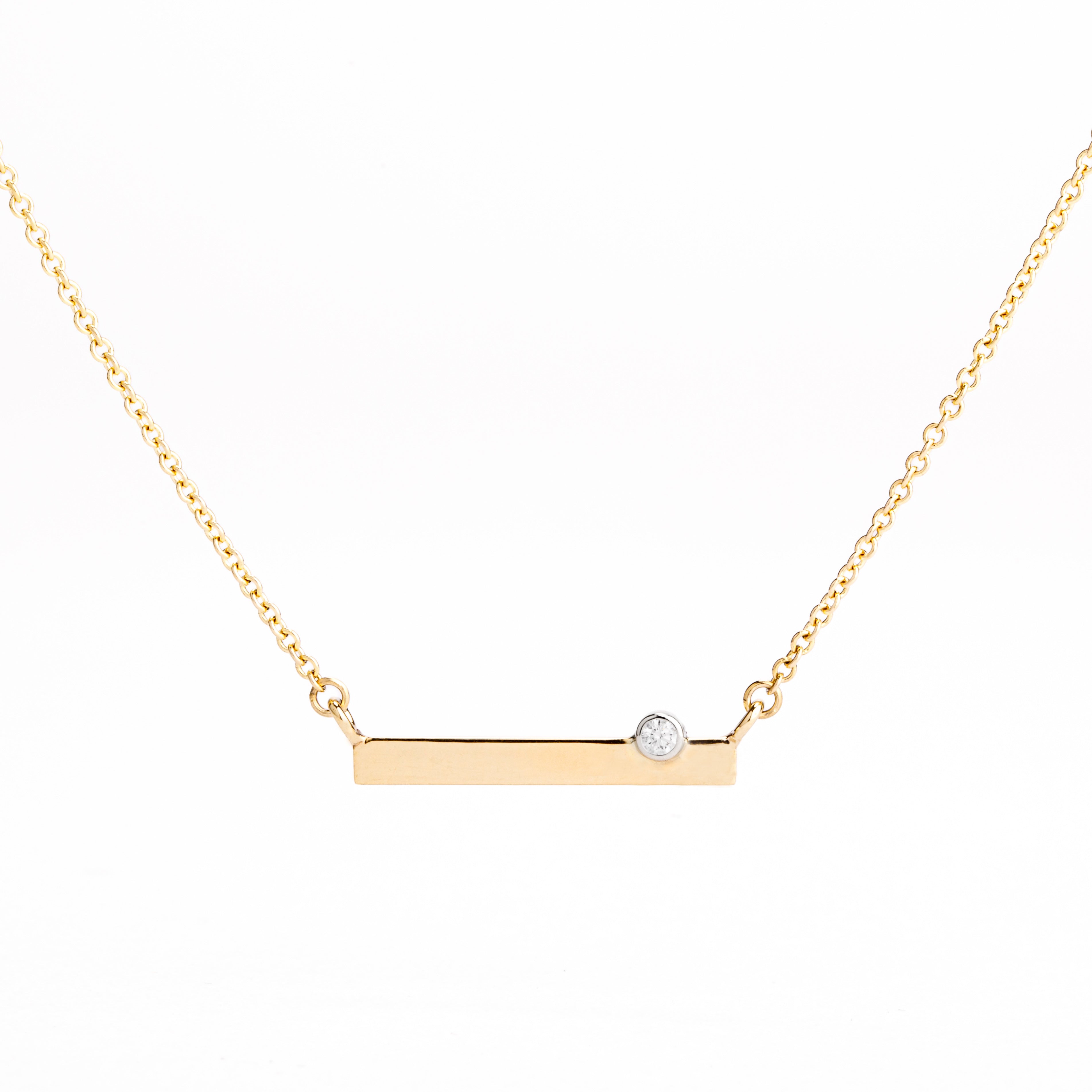 14k yellow gold bar necklace with bezel set diamond on delicate chain
