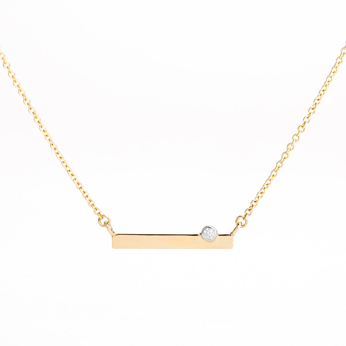 14k yellow gold bar necklace with bezel set diamond on delicate chain