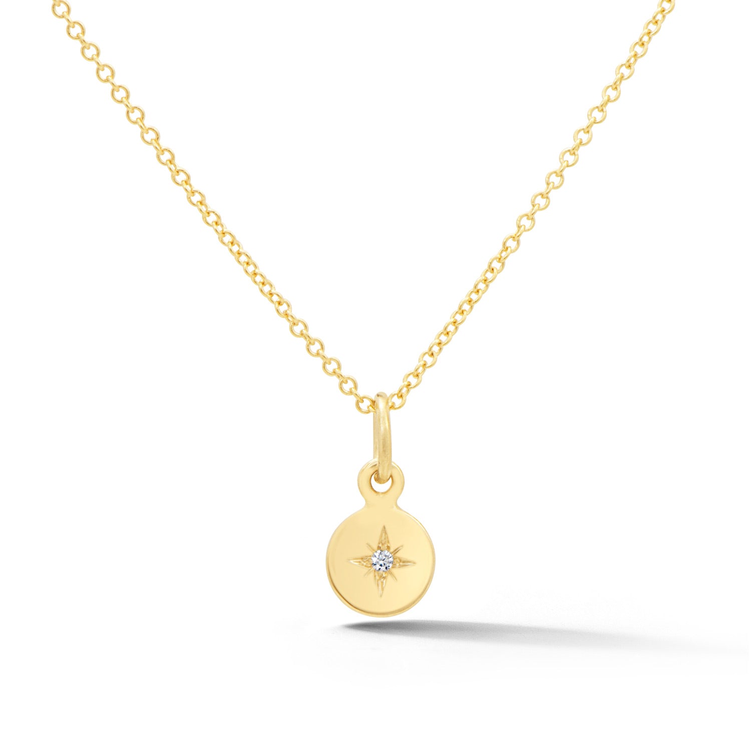 14k yellow gold disc pendant with diamond starburst design