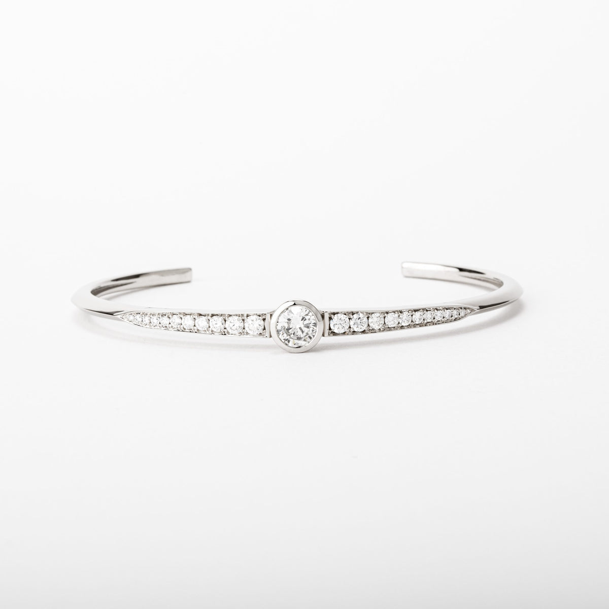 14k white gold diamond cuff bracelet with center bezel set diamond and pavé accents