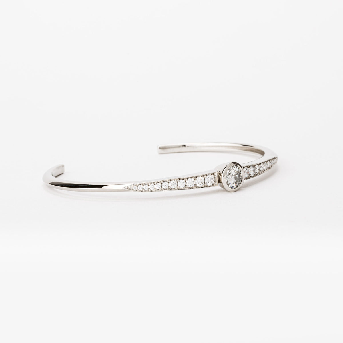 14k white gold diamond cuff bracelet with center bezel set diamond and pavé accents