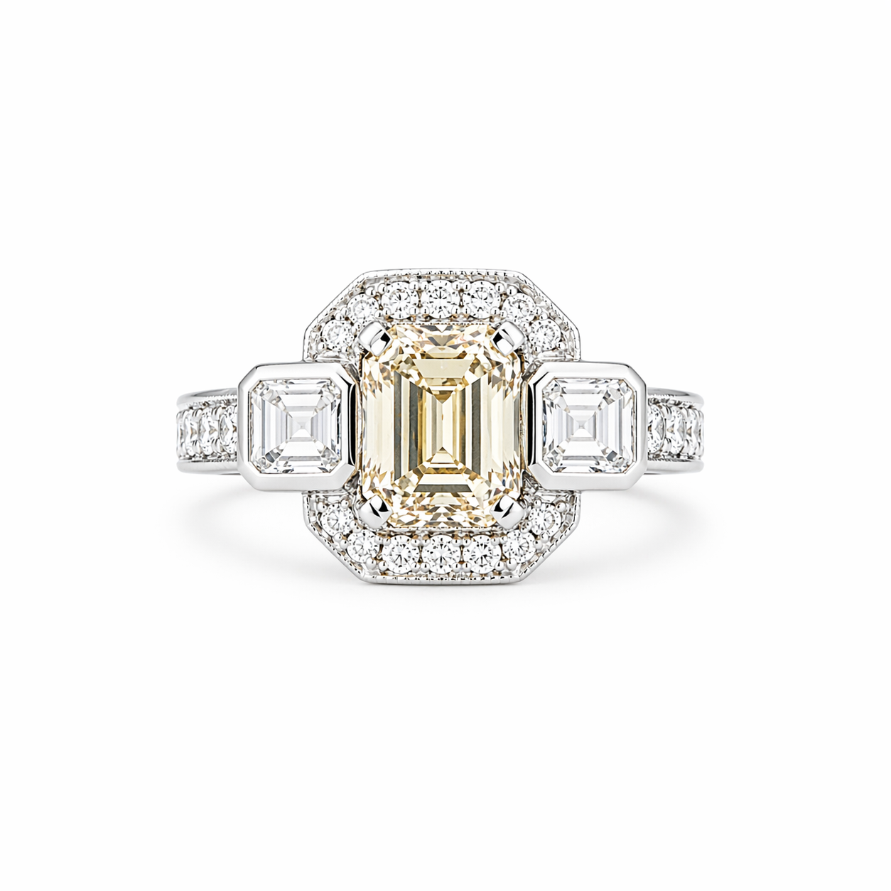 Platinum ring with emerald-cut champagne diamond, geometric halo, and diamond pavé band