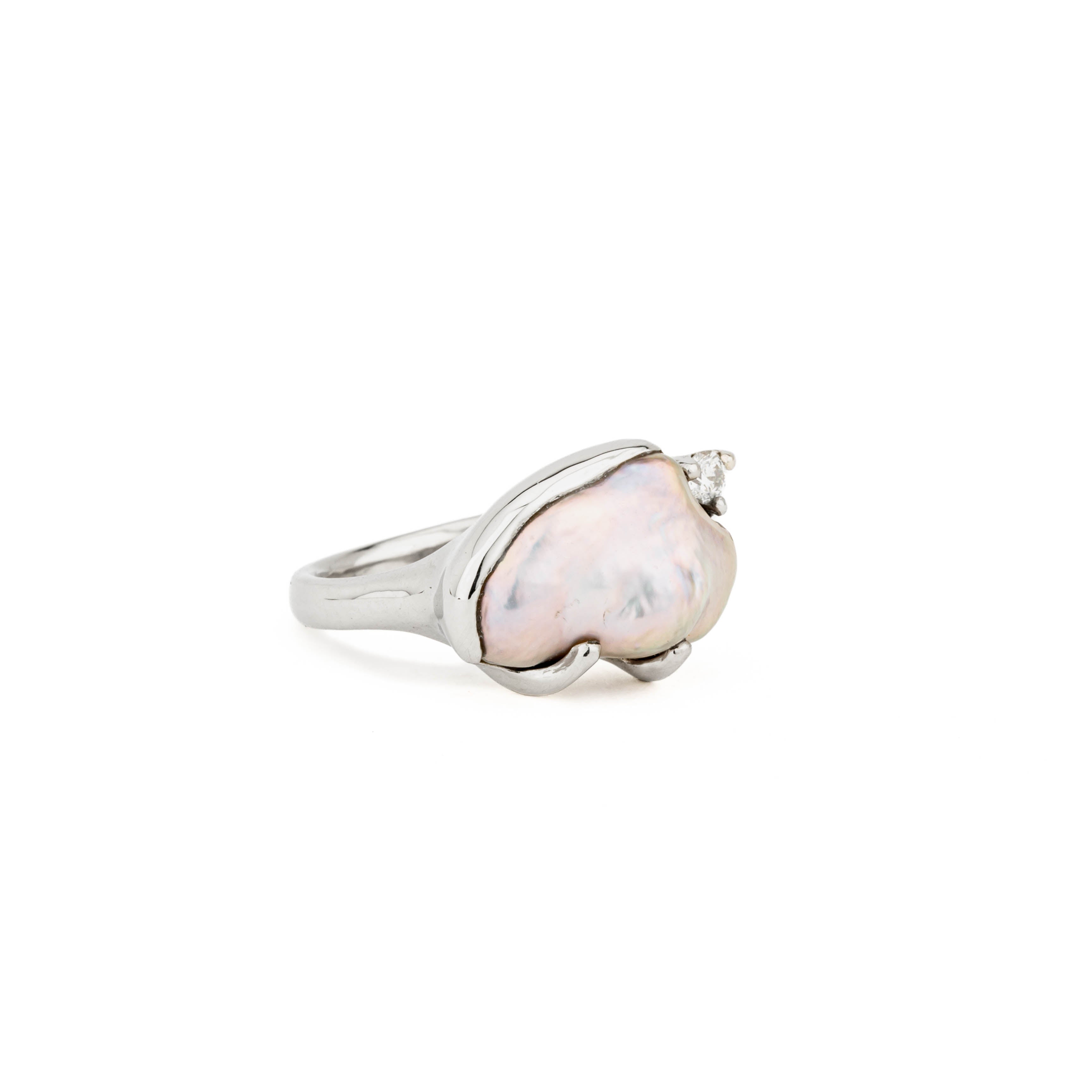 14k white gold ring with natural keshi freshwater pearl in freeform shape, accented by one round diamond, size 7.25