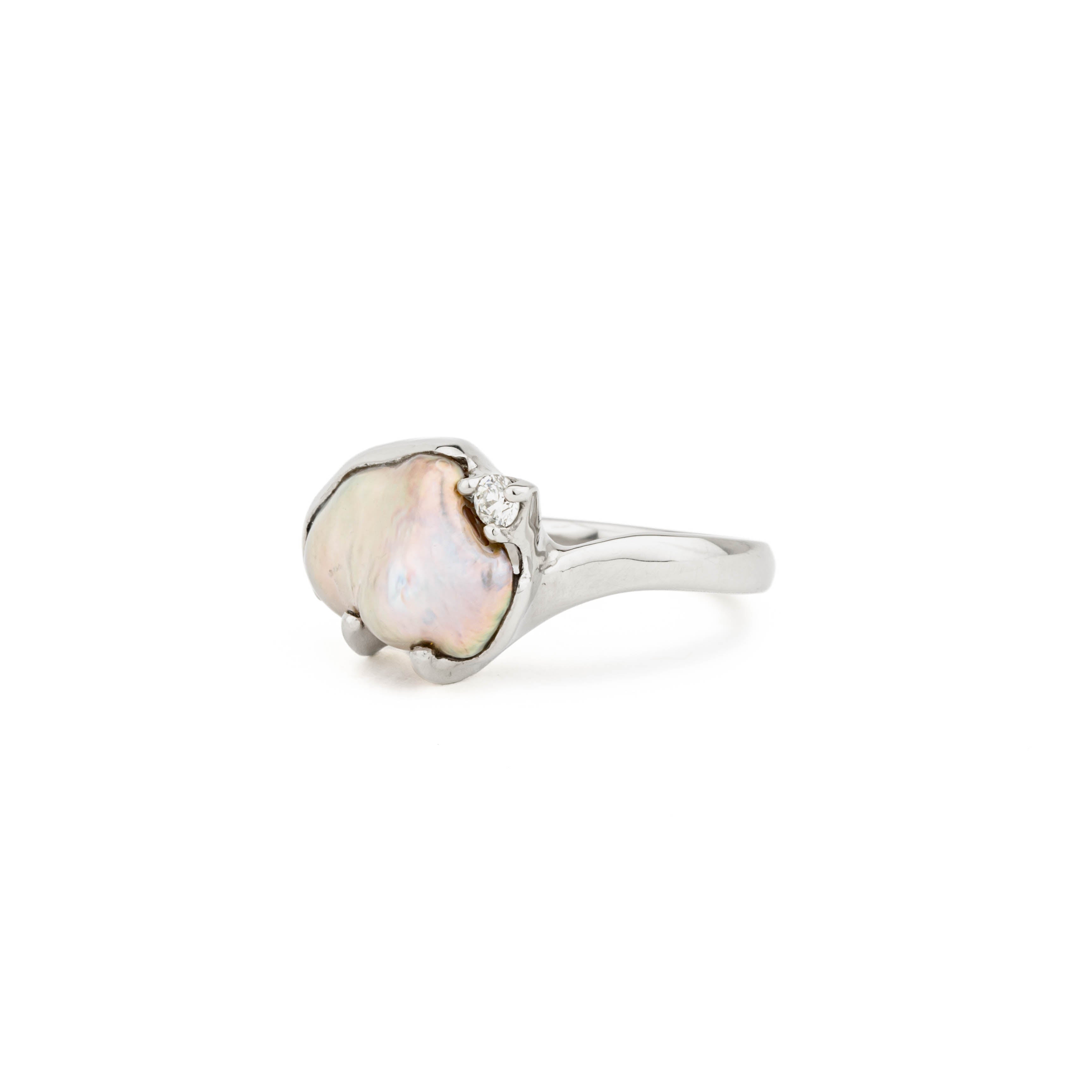 14k white gold ring with natural keshi freshwater pearl in freeform shape, accented by one round diamond, size 7.25