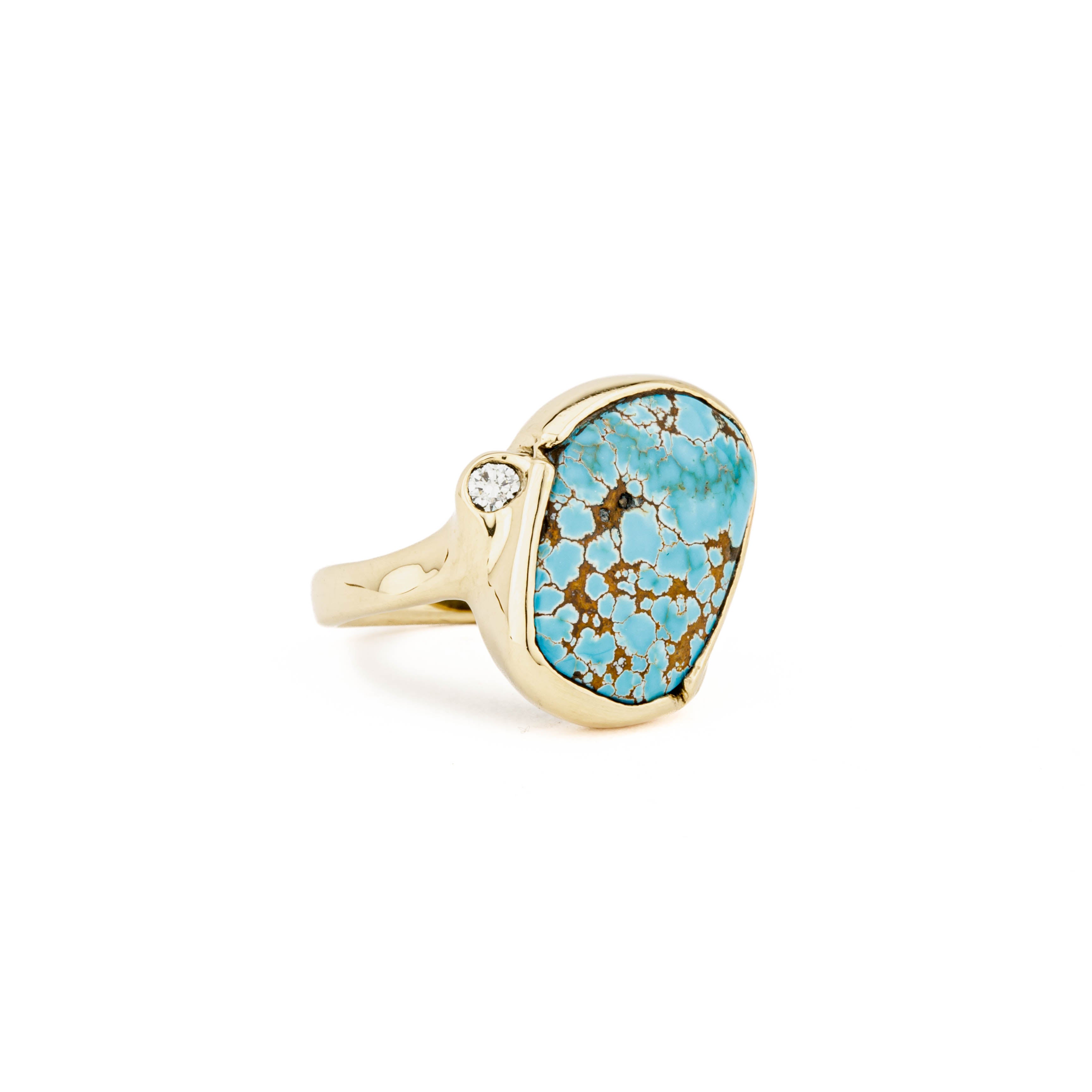 14k yellow gold ring with 7.2ct natural Lone Mountain turquoise in bezel setting and bezel-set round diamond accent, size 7
