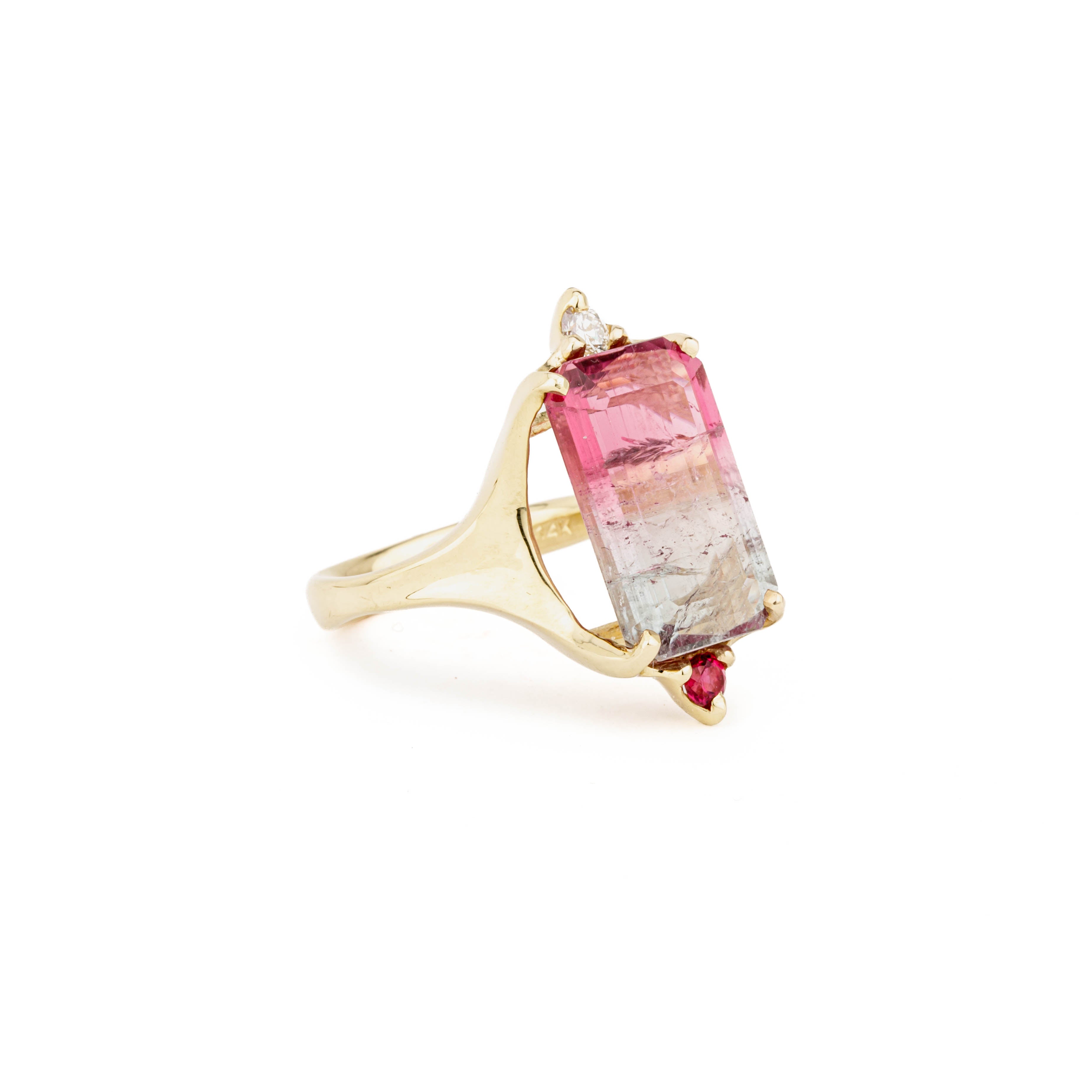 14k yellow gold ring with an emerald cut bi-color pink and green tourmaline, diamond accent, and reddish sapphire accent, size 7.75