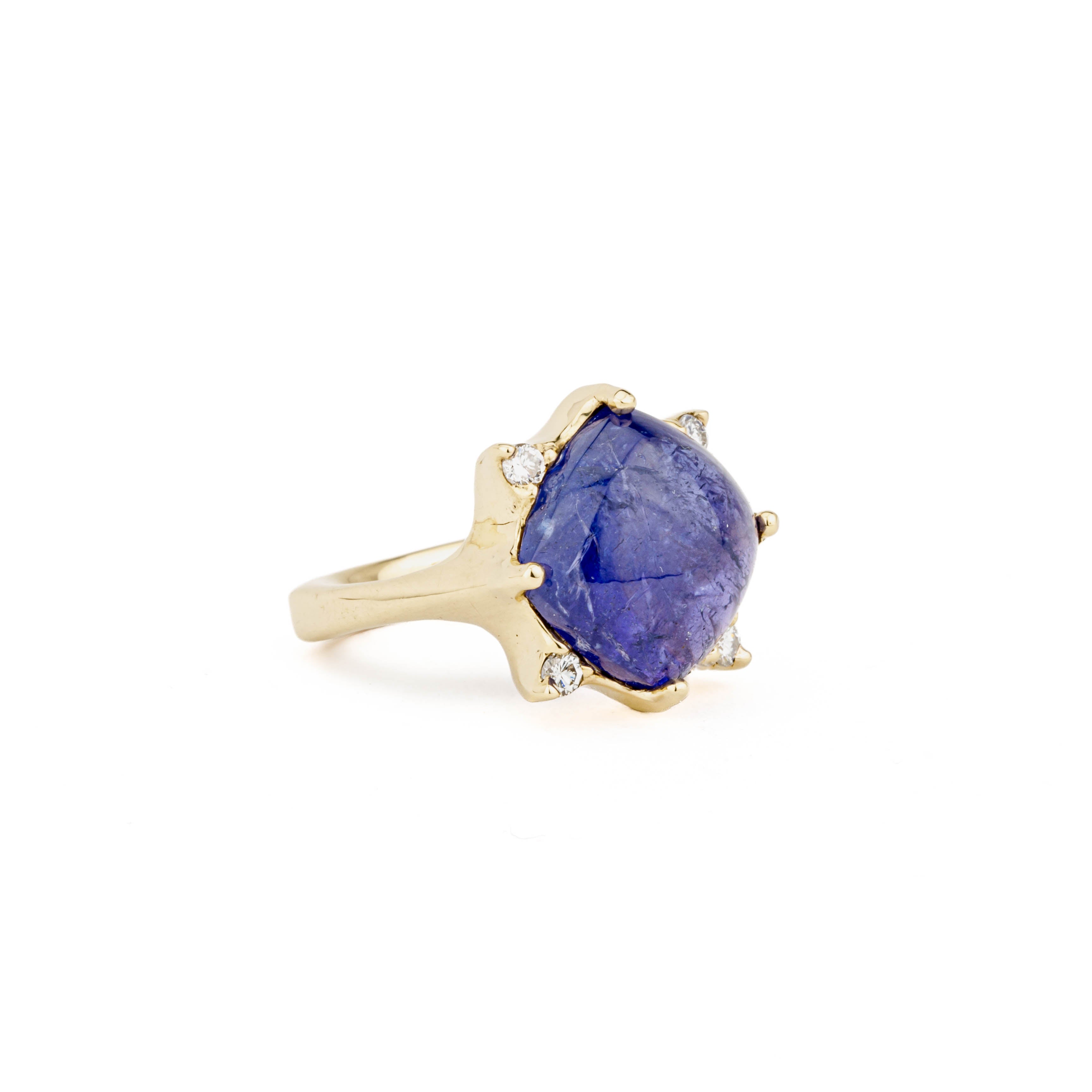 14k yellow gold ring with 11.79ct cabochon tanzanite center stone and four round diamond accents in a sunburst setting, size 7.25