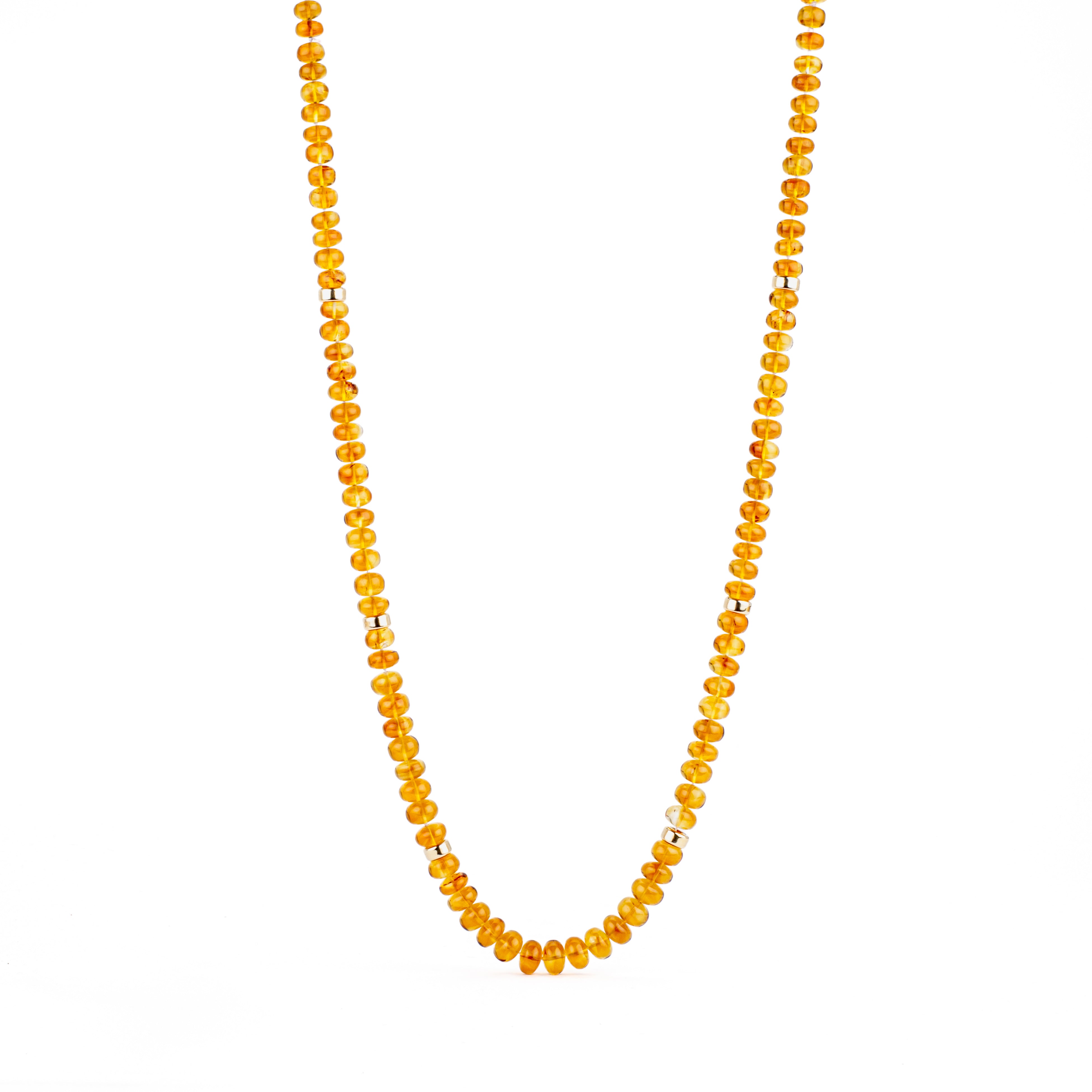 Graduated citrine beaded necklace with 14k yellow gold rondels, 21.5 inches