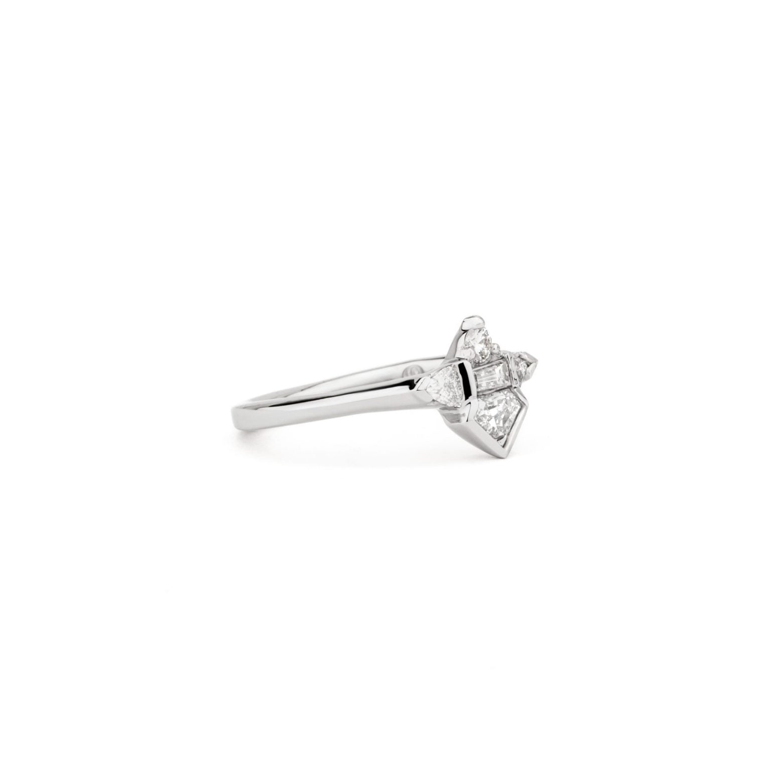 One of a kind platinum shield diamond ring with baguette, round and triangle diamond accents