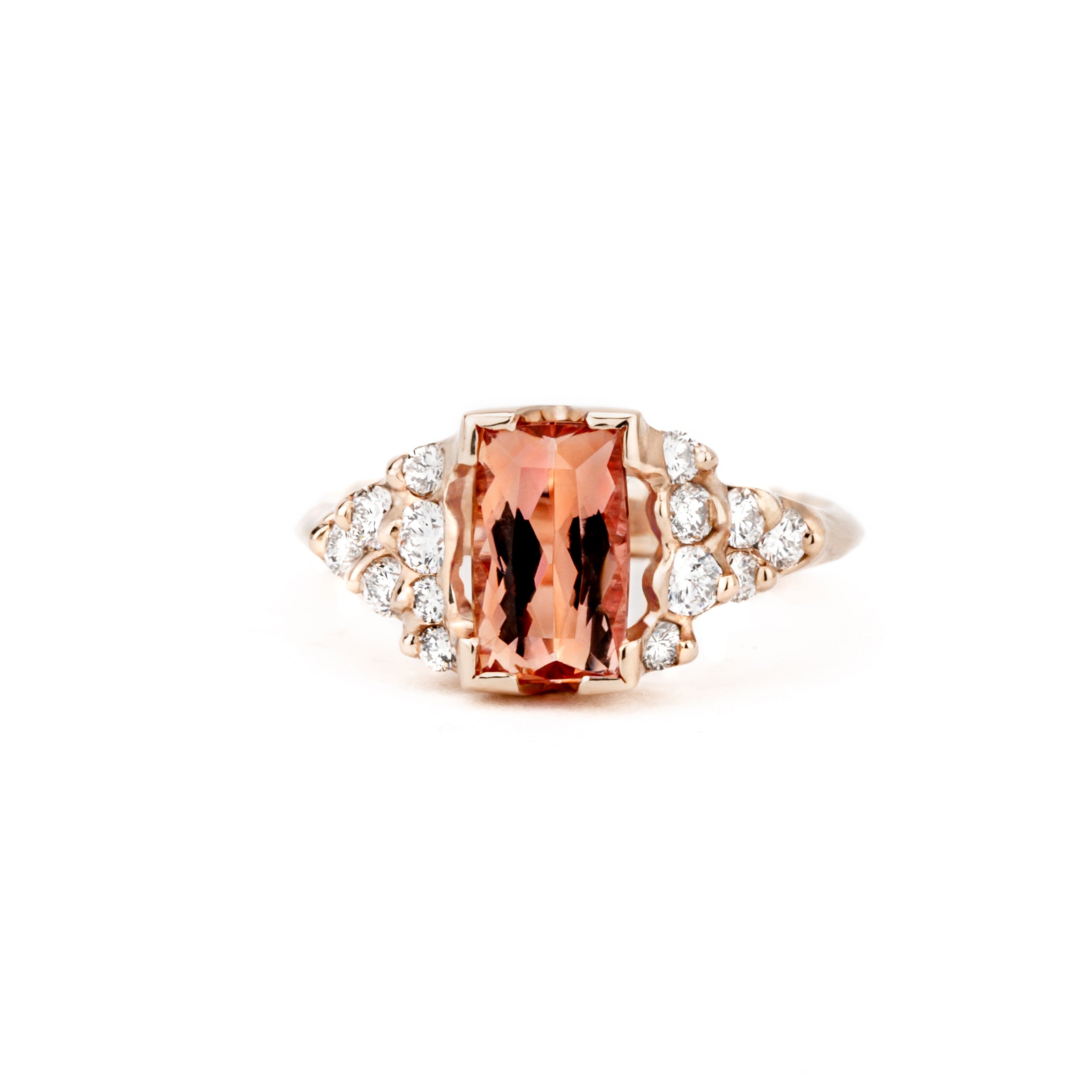 14k rose gold ring featuring a 1.88ct imperial topaz with clustered round diamond shoulder accents