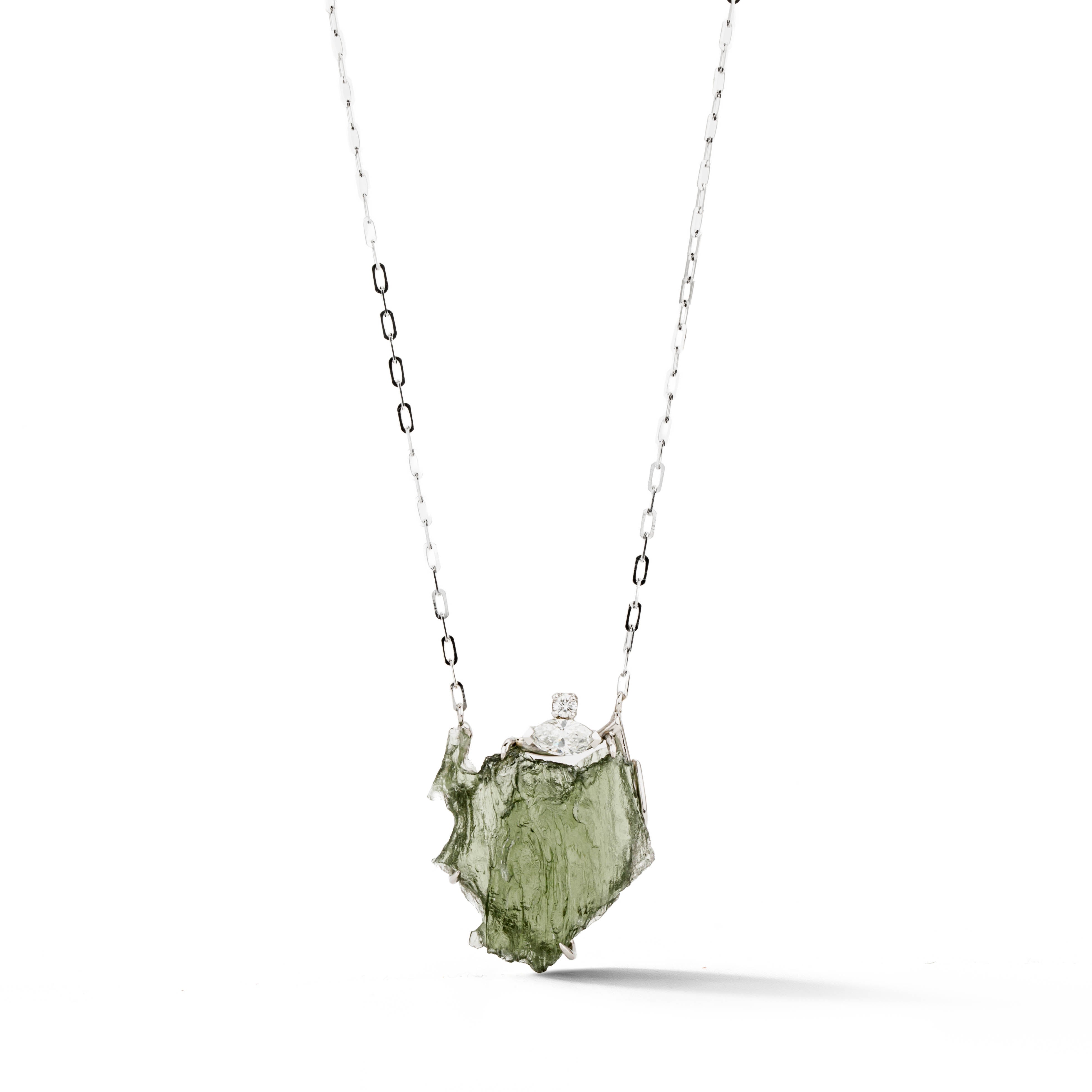 Palladium and platinum pendant necklace with rough green Besednice moldavite stone and marquise diamond accent, on a white gold chain.