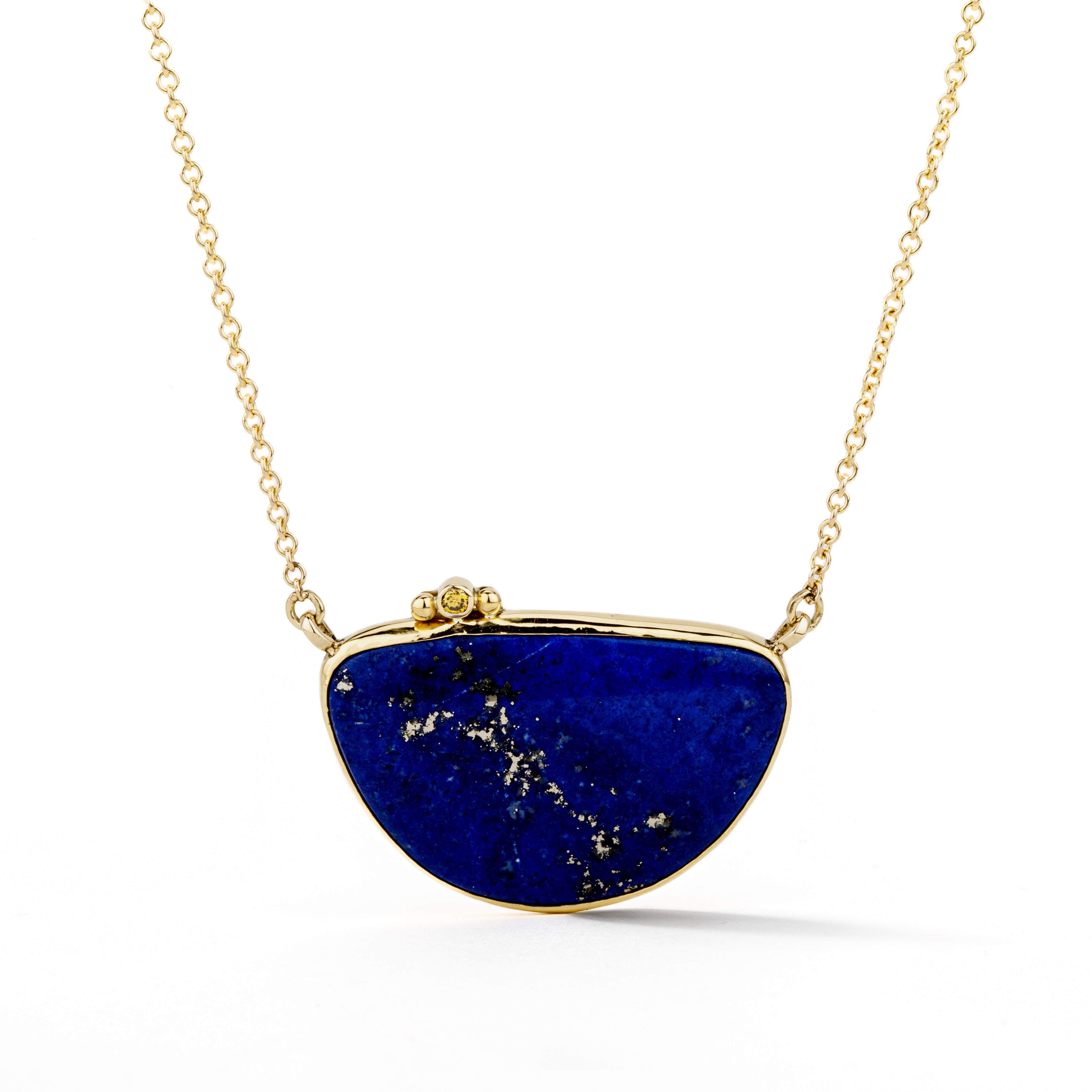 Half-moon lapis lazuli pendant necklace in 18k yellow gold with a yellow diamond accent, on a 14k gold cable chain.