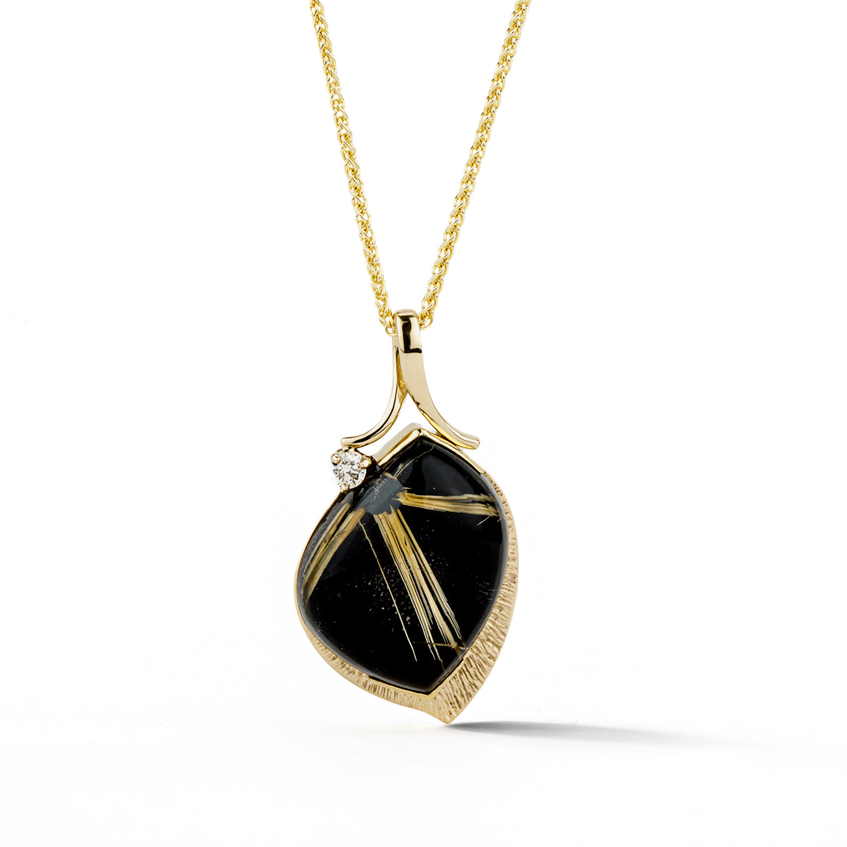 Rutile quartz pendant in textured 14/18k yellow gold with golden needle inclusions and a round brilliant diamond accent