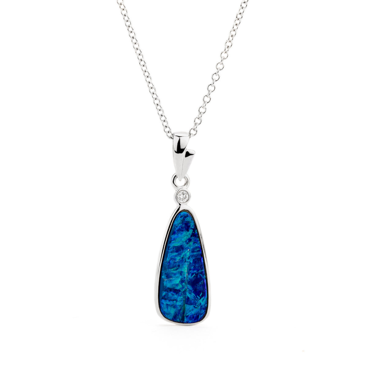 14k white gold pendant necklace featuring a deep blue freeform opal doublet with bezel-set diamond accent