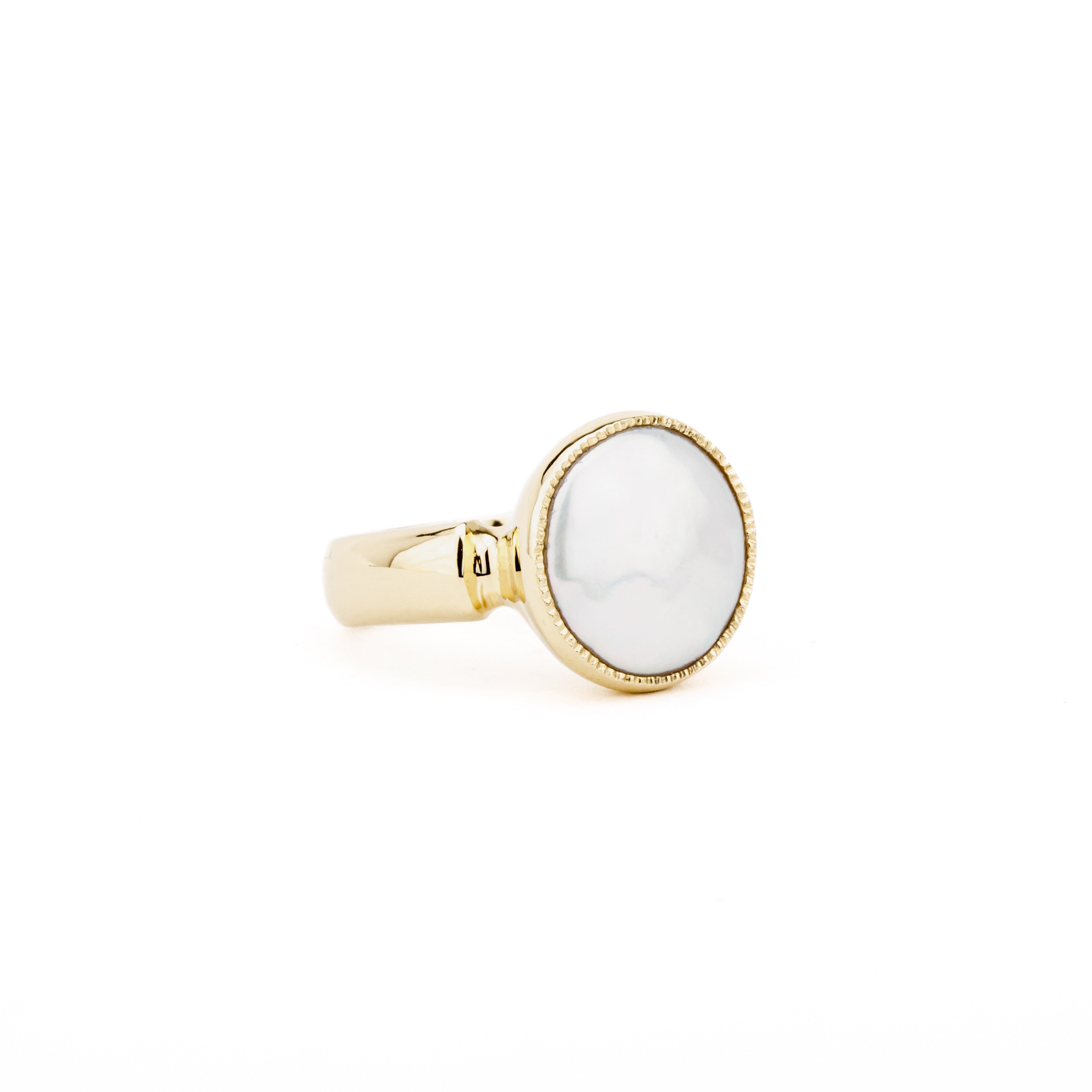 One-of-a-kind 14k yellow gold ring featuring a white coin pearl in a lightly textured milgrain bezel setting on a polished band, size 6.5