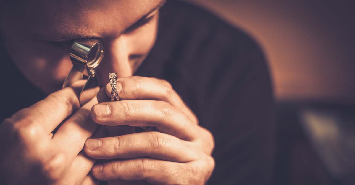 man appraising jewelry