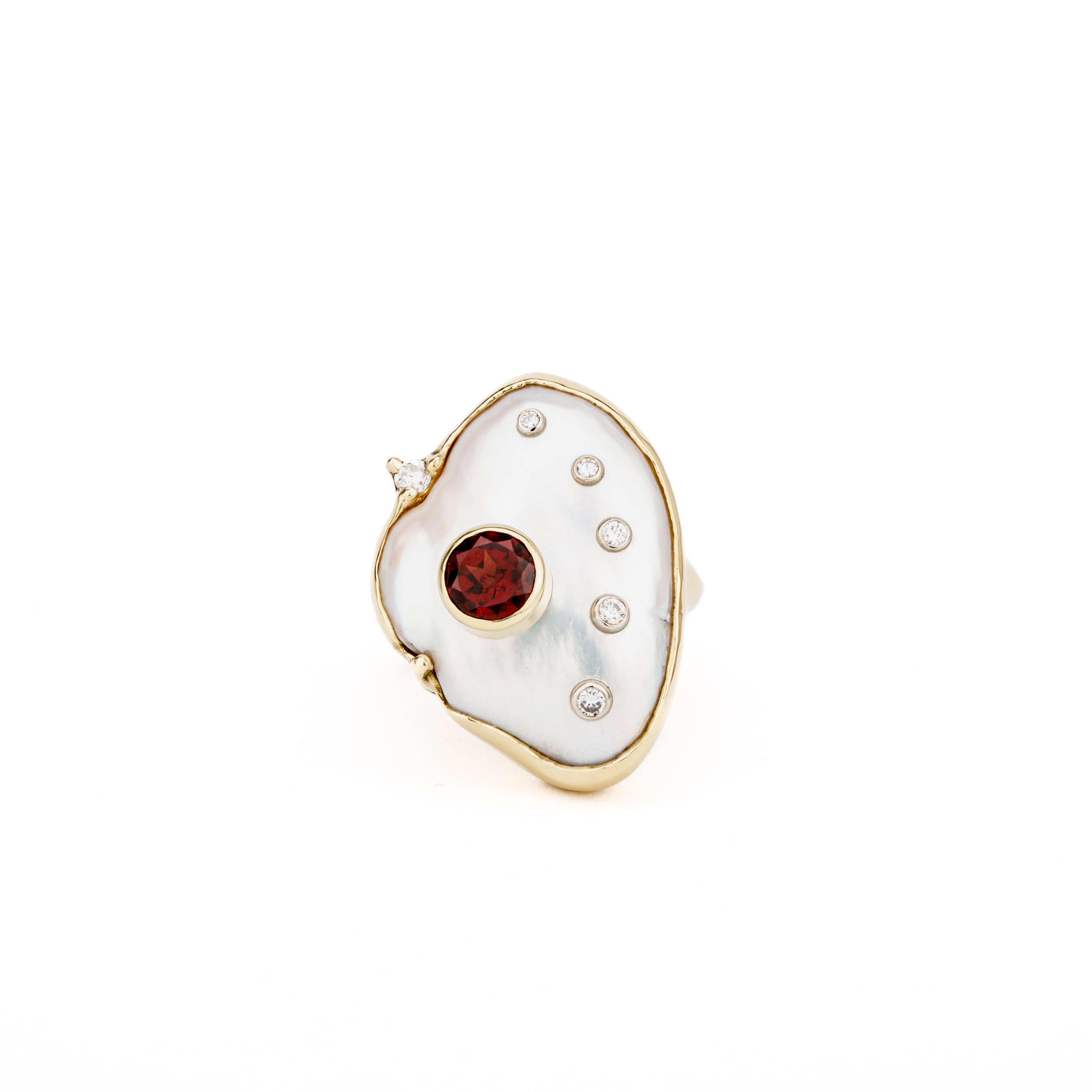 One-of-a-kind 14k yellow gold ring featuring a freeform baroque keshi pearl face set with a bezel-set rhodolite garnet and six diamond accents