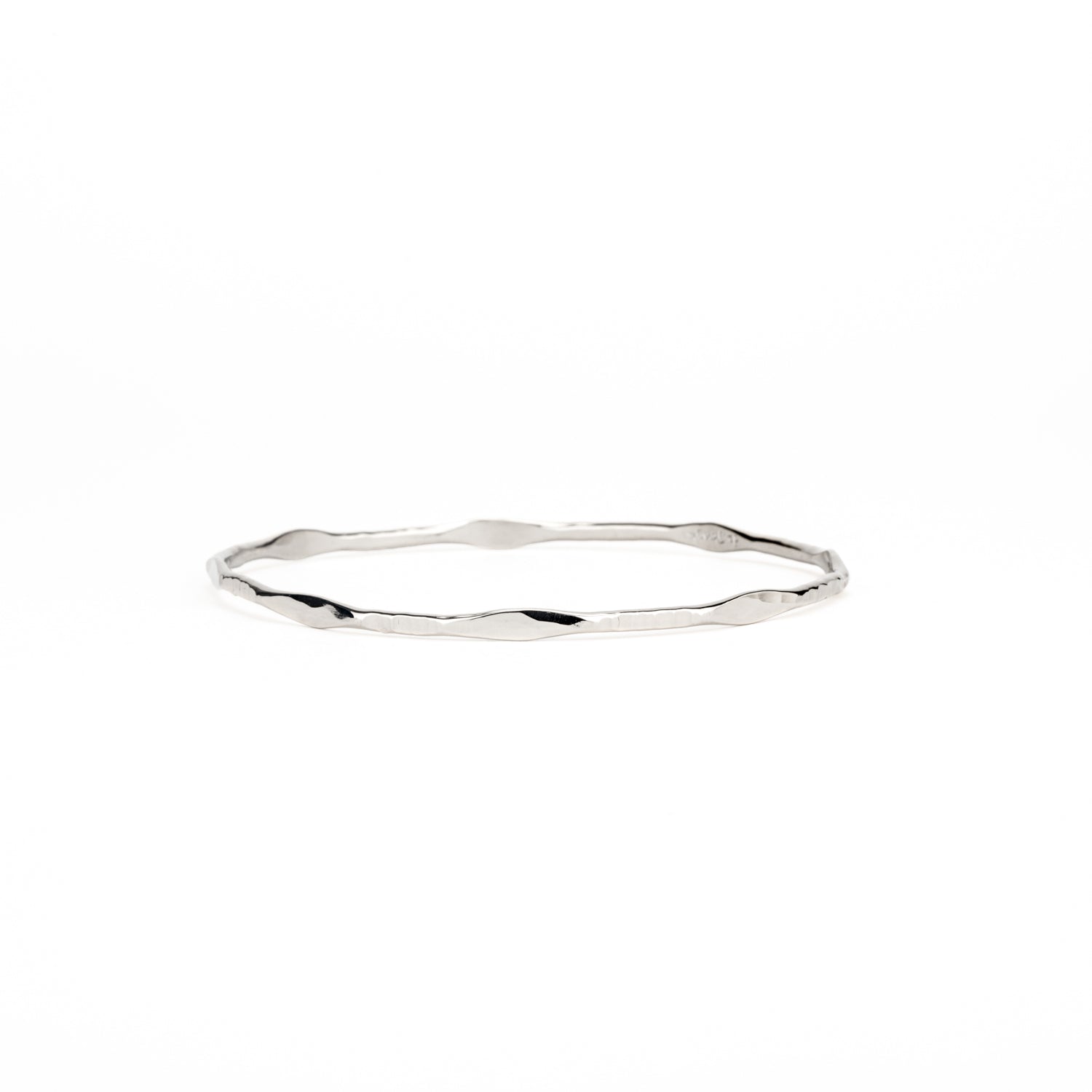 Forged 14k white gold bangle bracelet with rivet accents 