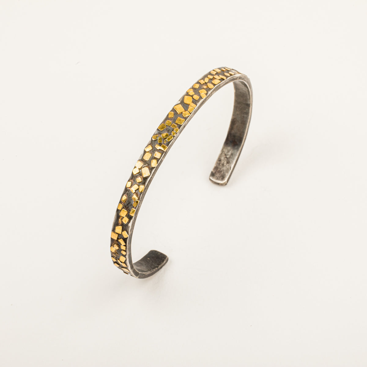 Oxidized sterling silver cuff bracelet with scattered 22k yellow gold flake accents