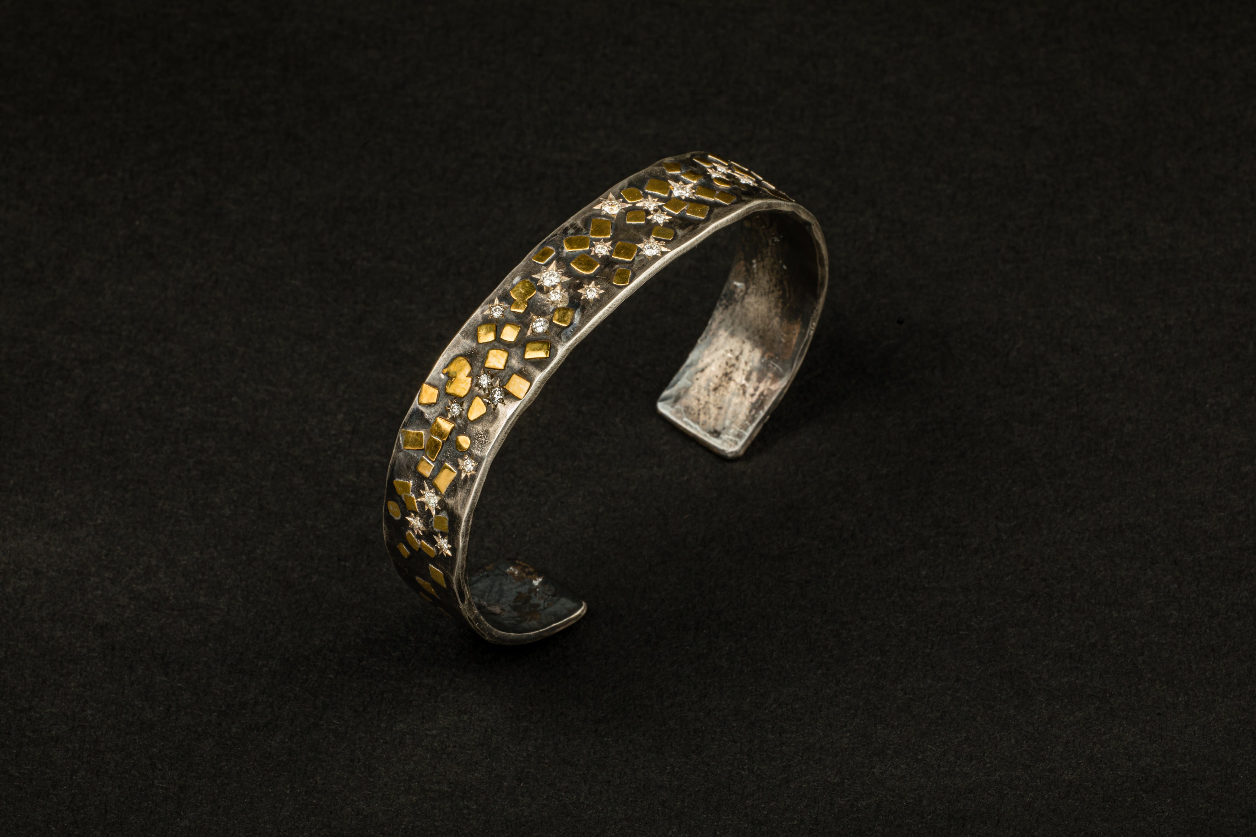 Oxidized sterling silver cuff bracelet with scattered 22K yellow gold flake accents and 24 star-set diamonds