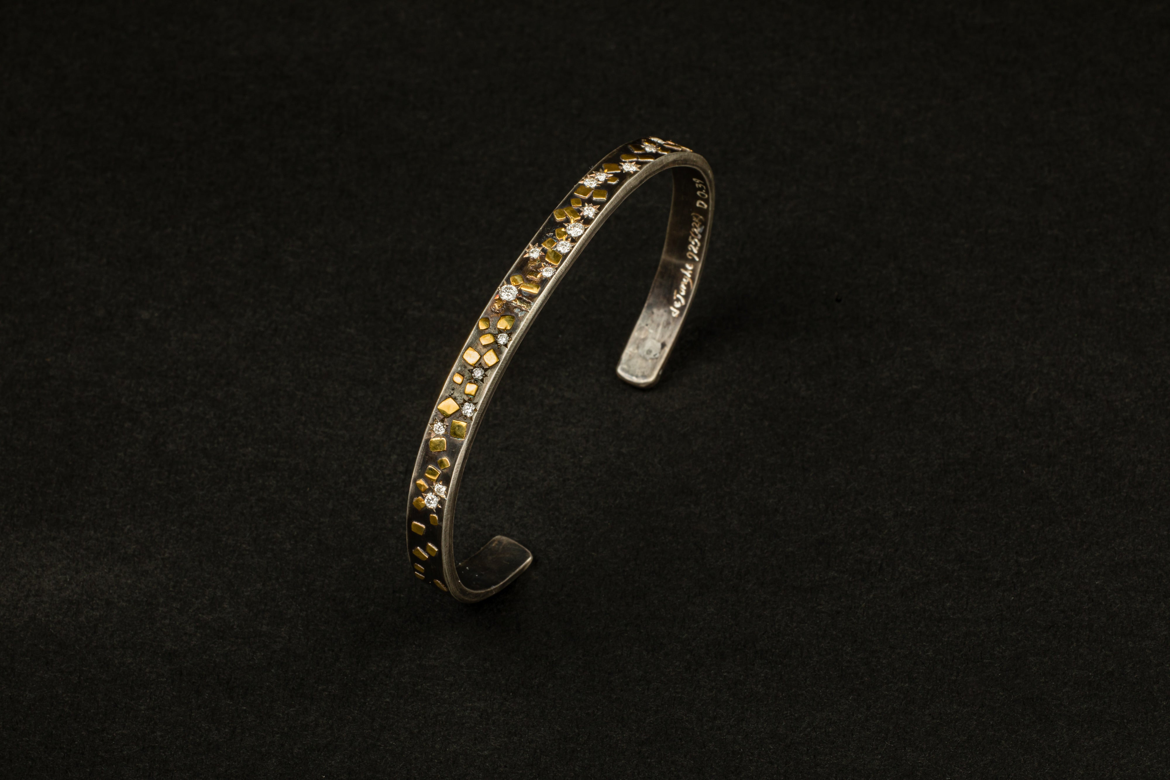 Oxidized sterling silver cuff bracelet with 22k yellow gold flake accents and diamond star settings