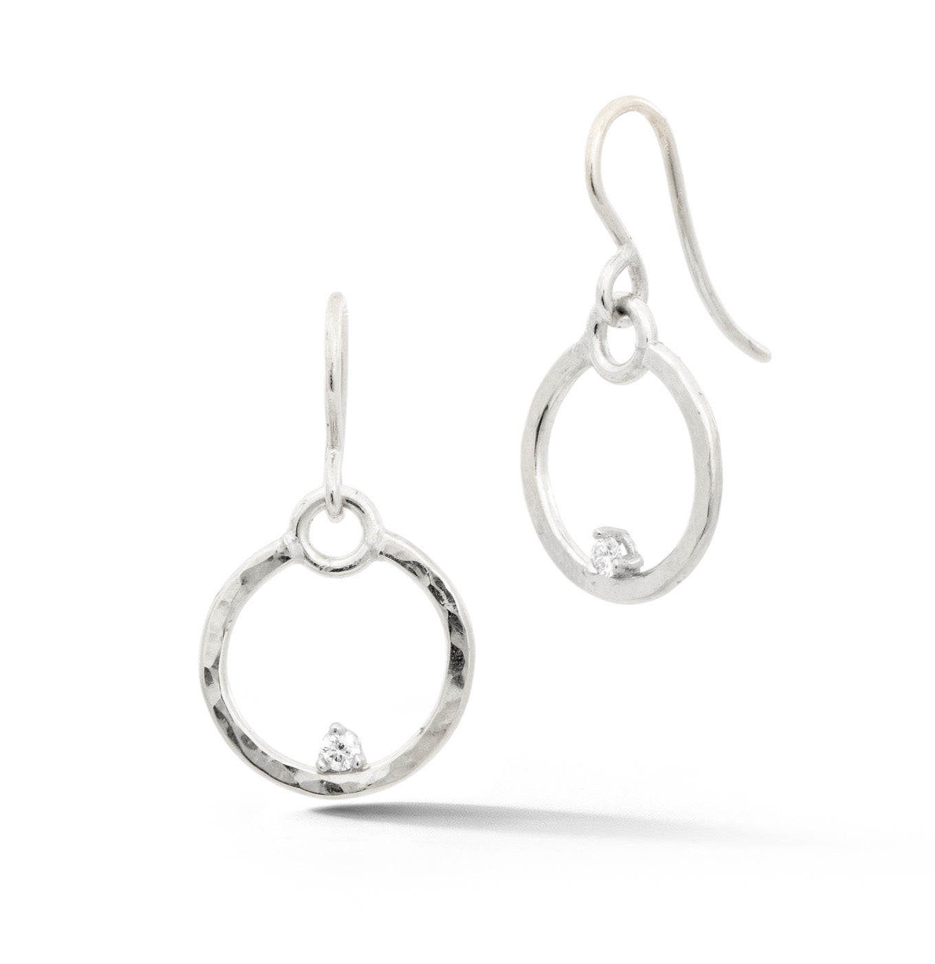 14k white gold forged circle earrings with diamonds hanging from french wires