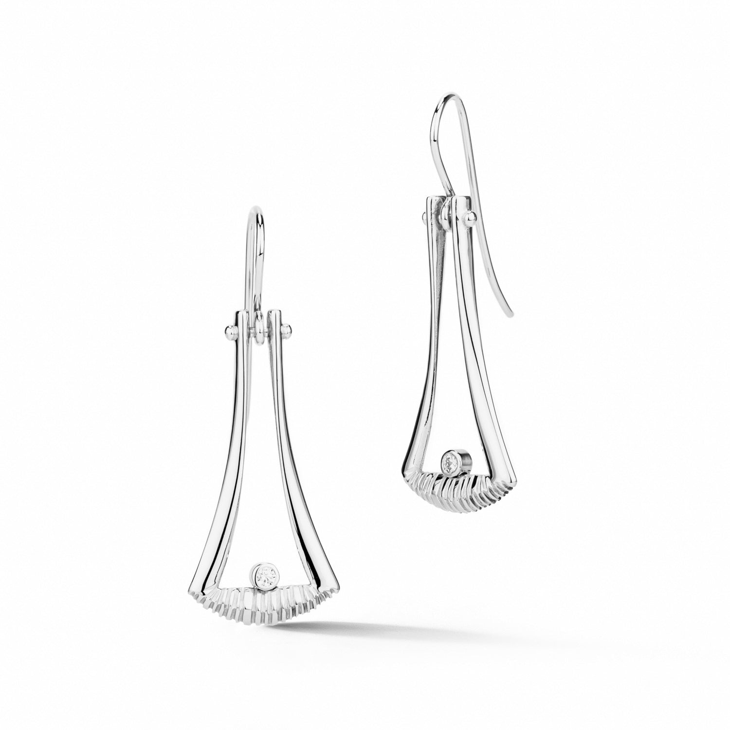 14k white gold flared dangle earrings with textured detail and diamond accents