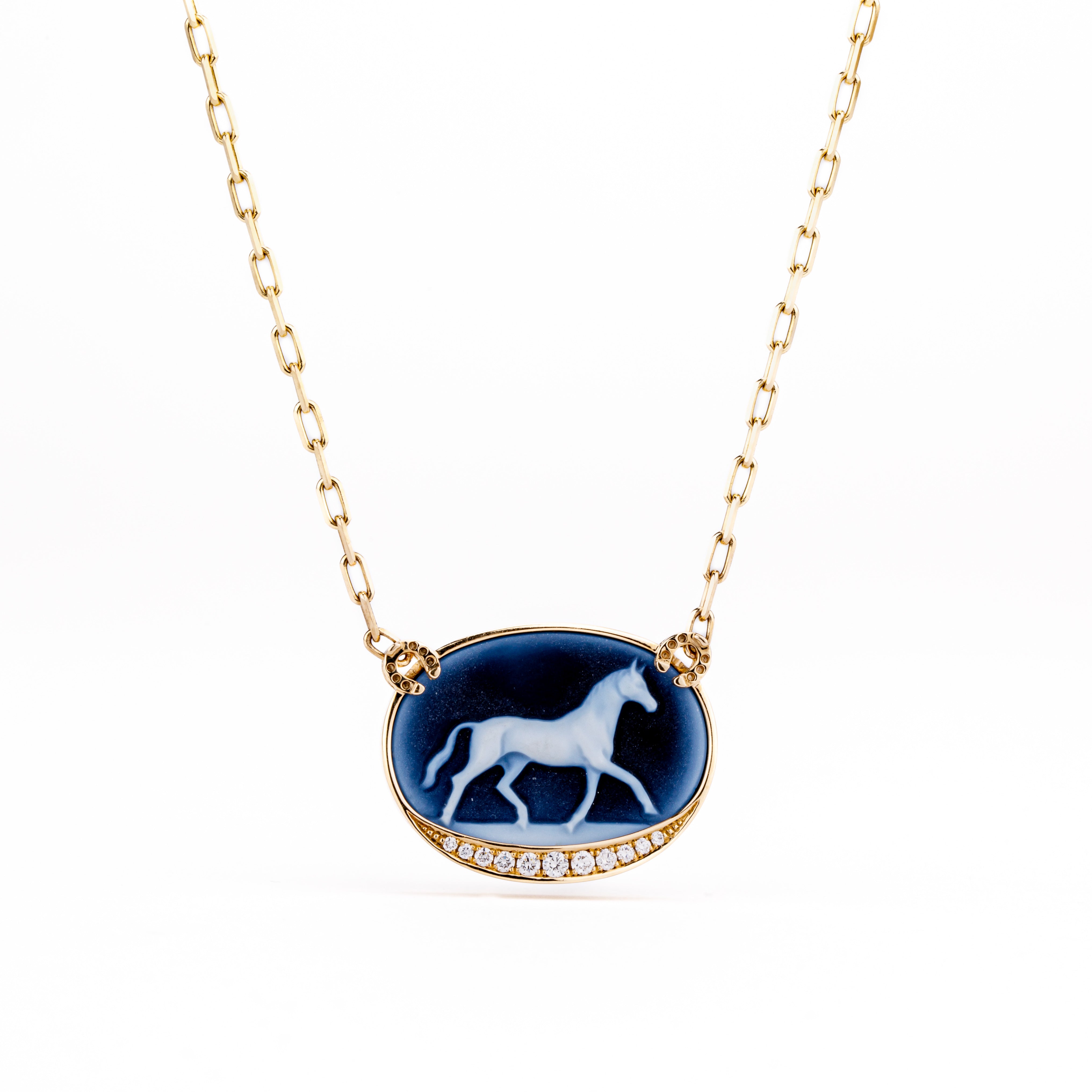 Carved horse cameo in 14k yellow gold accented with round brilliant diamonds 