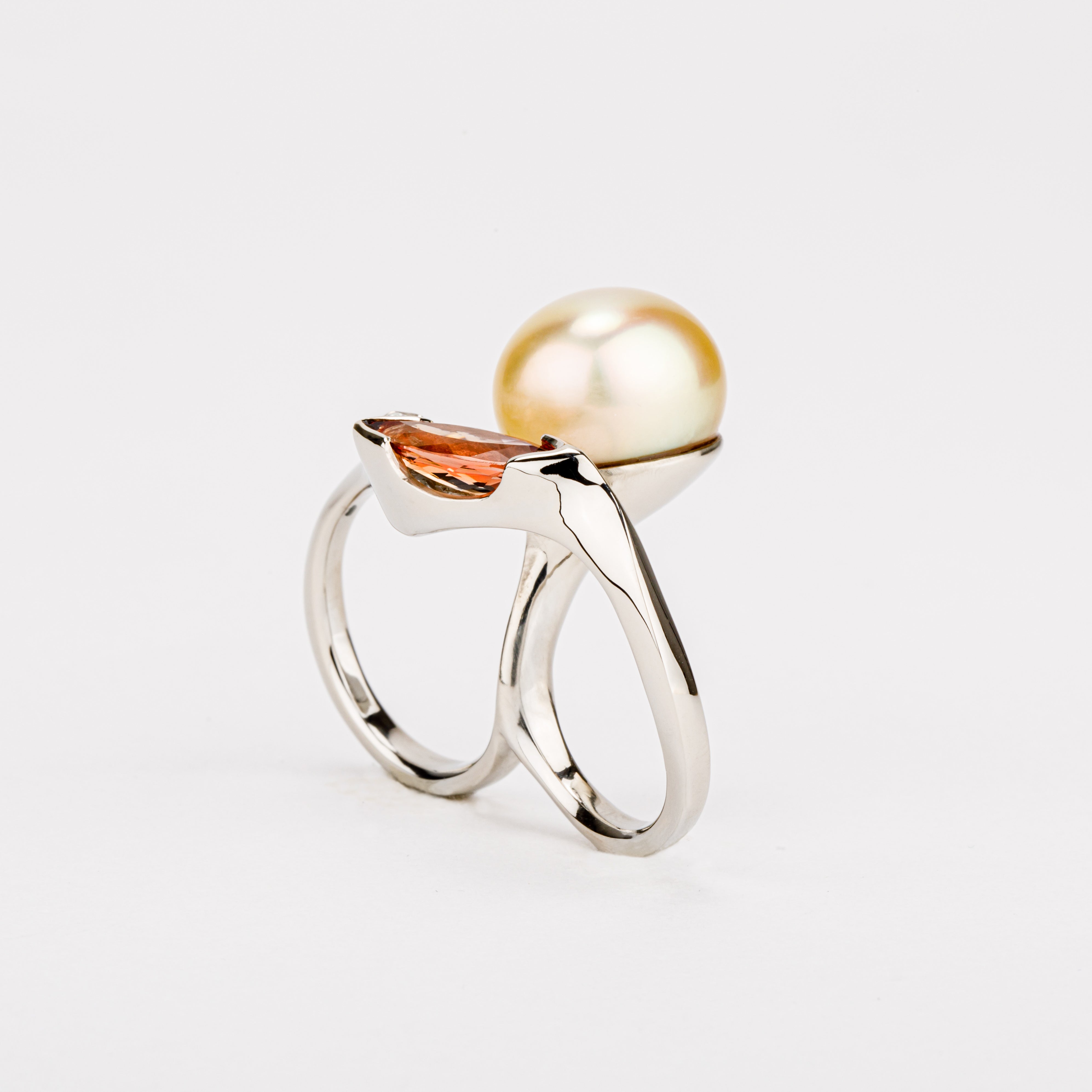 One of a kind golden Tahitian pearl double finger ring with imperial topaz and diamond in 14k white gold