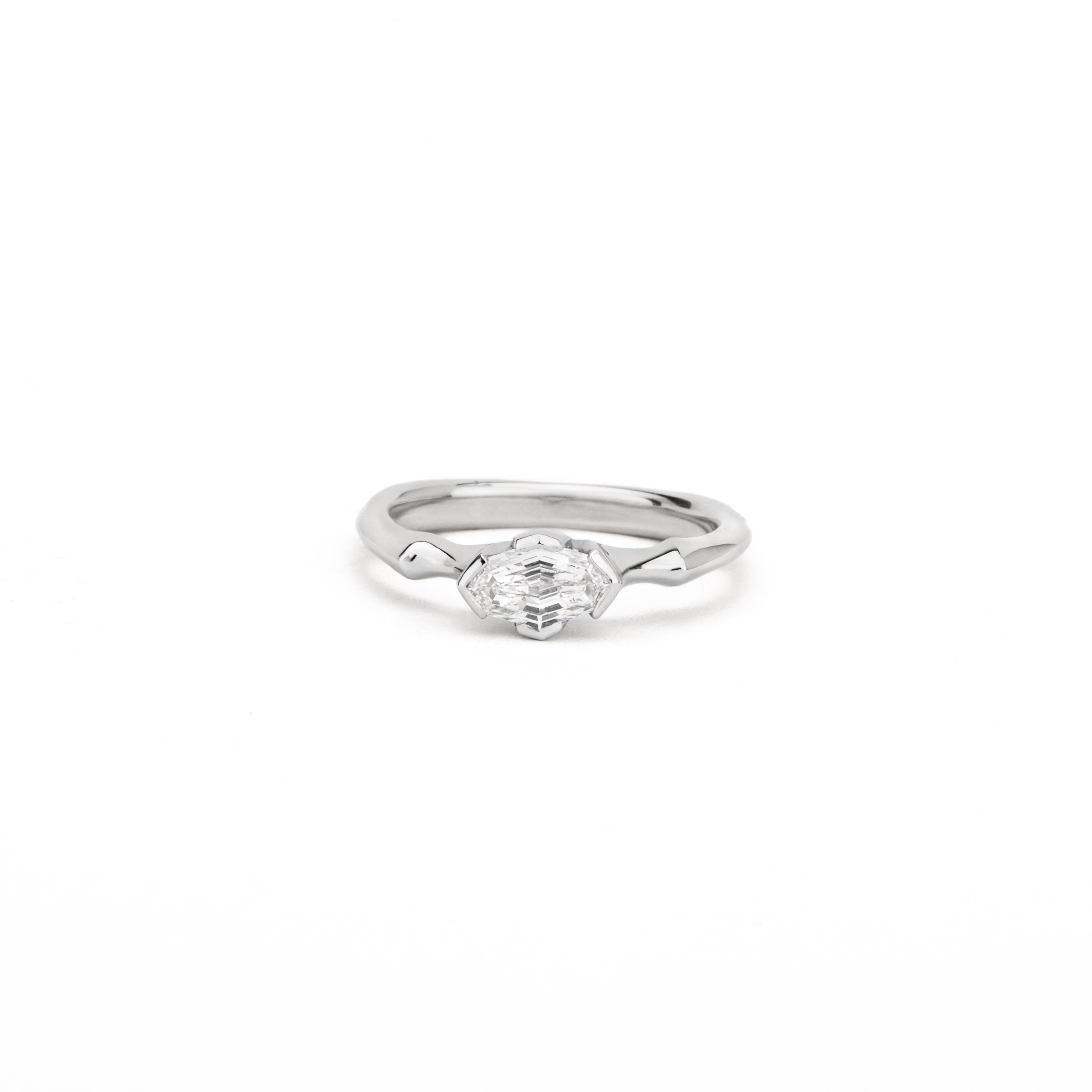 One of a kind platinum ring with fancy oval diamond in sculptural wrap setting 